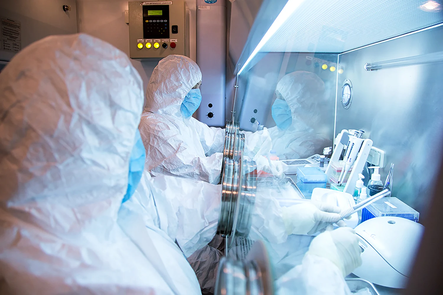 This undated photo released by the Irkutsk Anti-Plague Research Institute of Siberia and Far East, shows the institute workers in a lab.