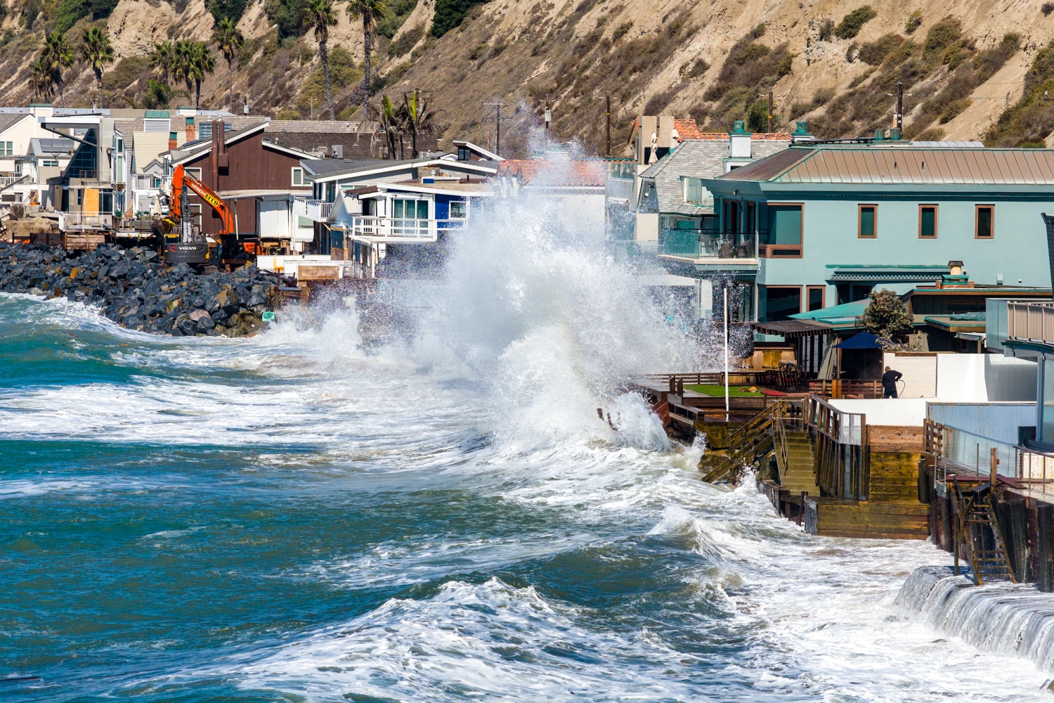 Powerful swells from Hurricane Polo, combined with a high tide, crash over protective boulders and seawalls along Beach Road in Capistrano Beach, Calif., on Sept. 29, 2026.