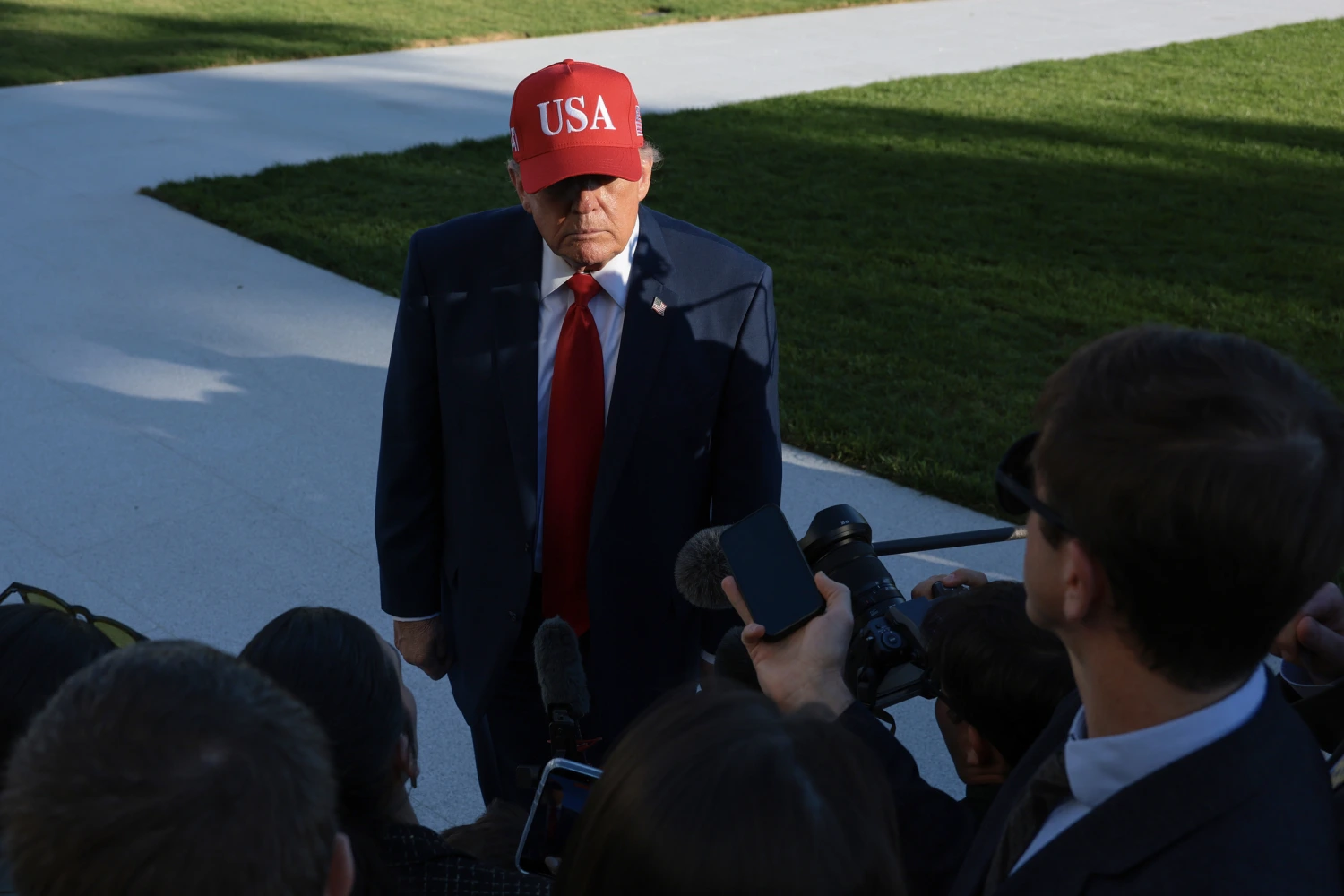 U.S. President Donald Trump speaks to members of the media on the South Lawn as he returns to the White House on Oct., 06, 2026 in Washington, D.C.