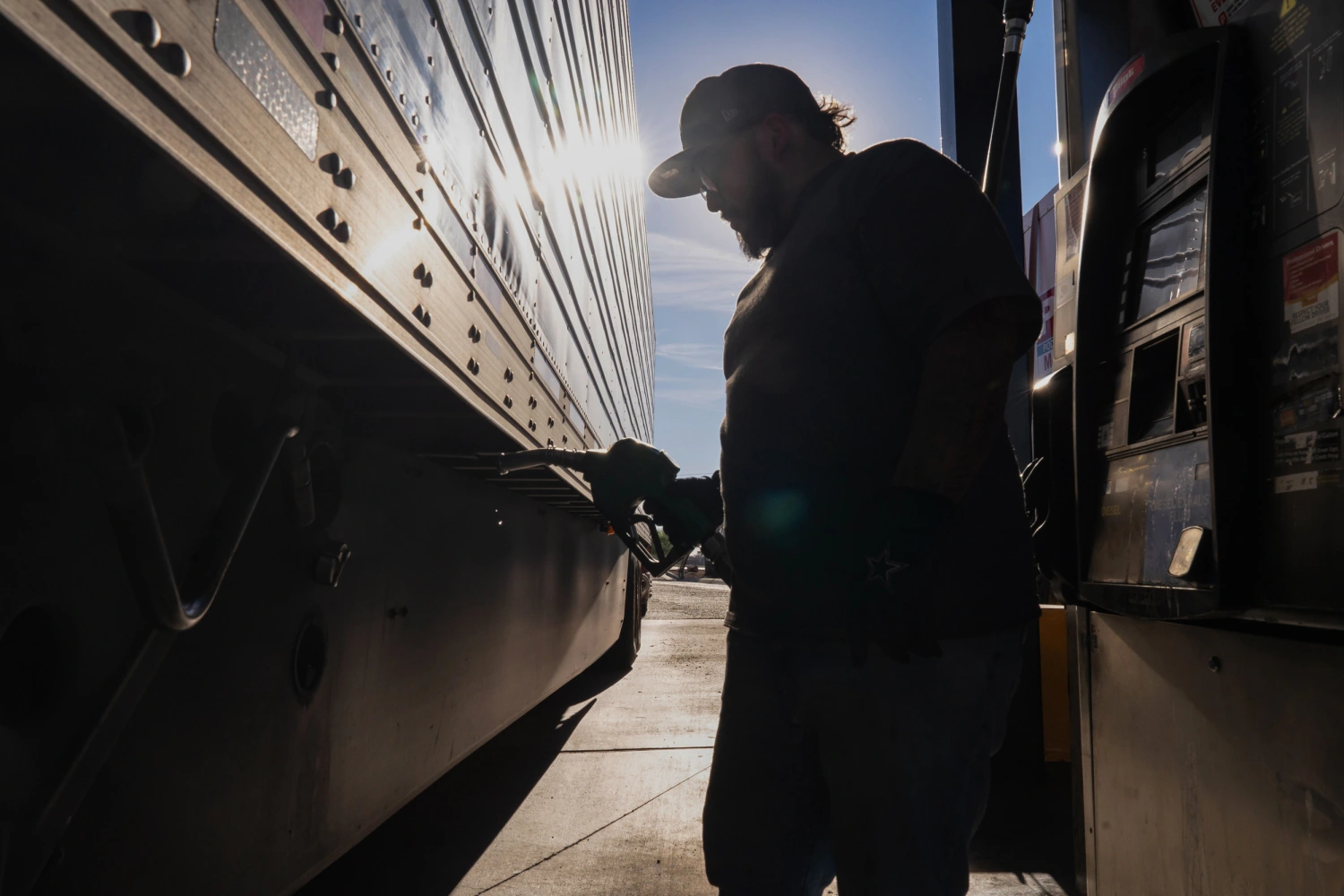 A semi truck driver refuels a truck with diesel fuel at a Pilot gas station in Eloy, Arizona, US, on Wednesday, March 18, 2026.