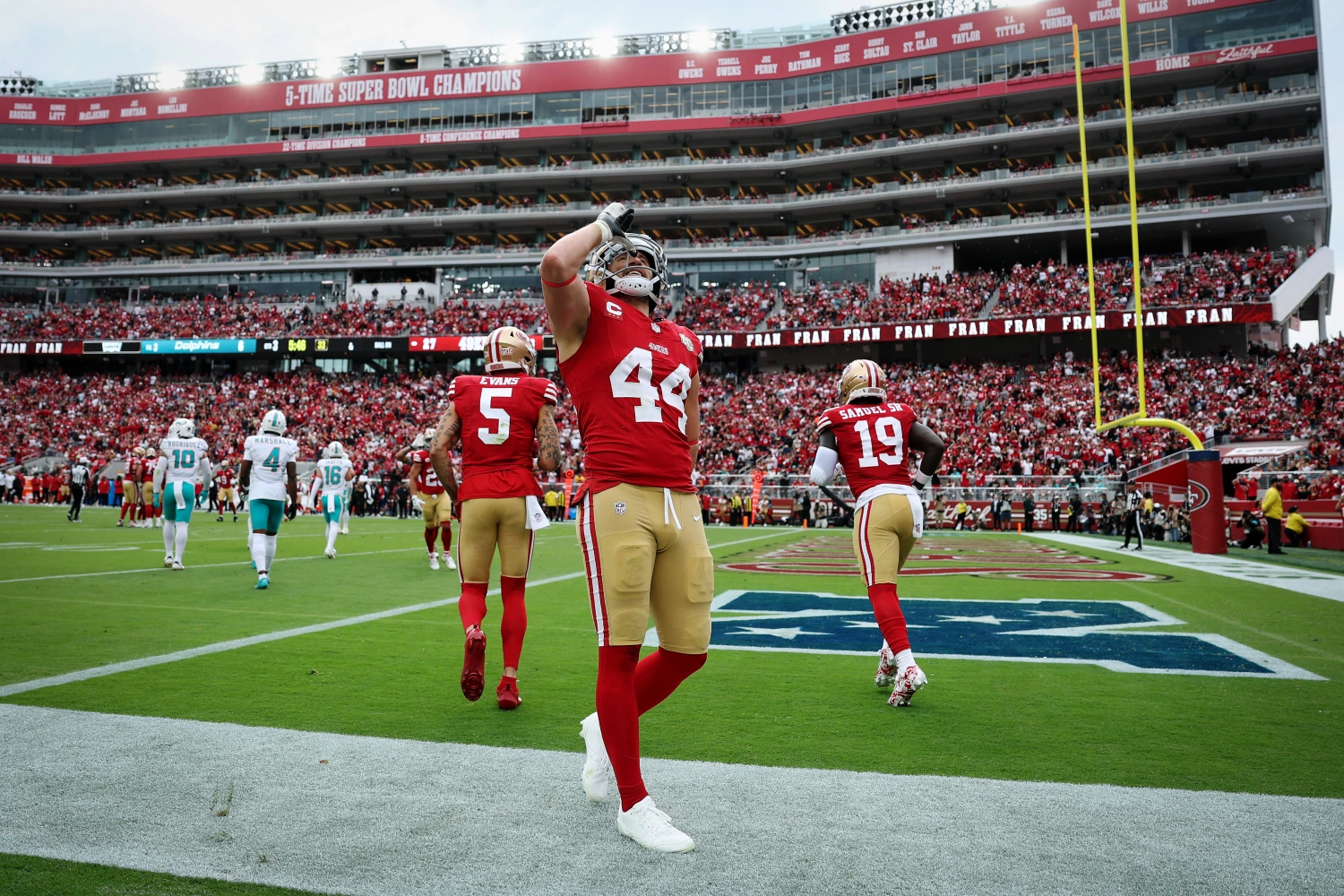 Kyle Juszczyk of the San Francisco 49ers performs his signature "drinking" gesture after scoring a touchdown against the Miami Dolphins on Sept. 20, 2026.
