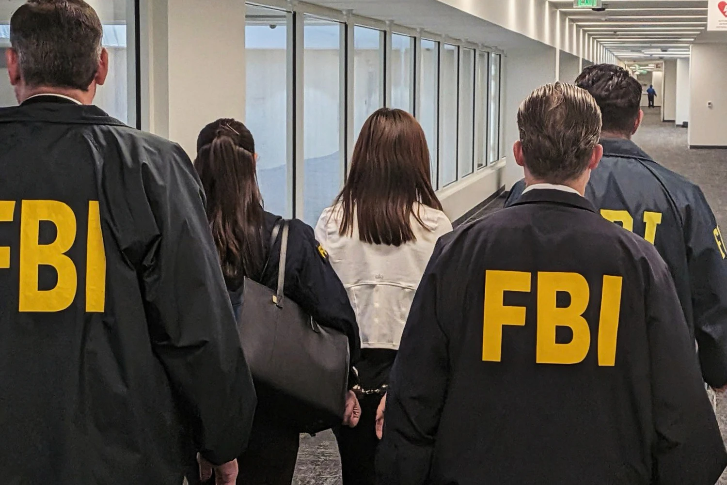 This photo provided by the Federal Bureau of Investigation shows Wanying Zhang being arrested Sunday, Oct. 4, 2026, in Los Angeles.