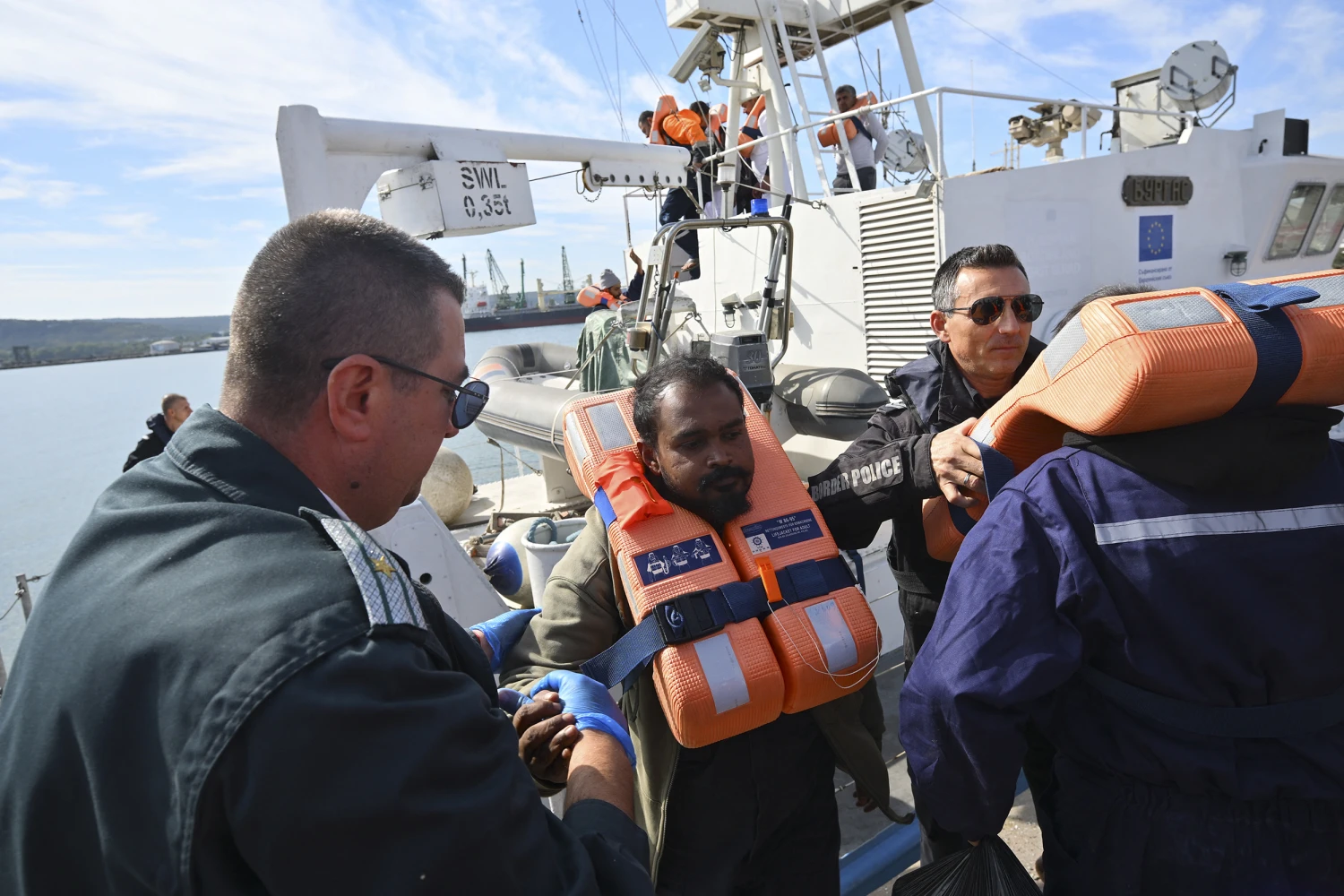 Crew members from a vessel struck by drones in Bulgaria's exclusive economic zone arrive at the port of Varna after being rescued on October 6, 2026.