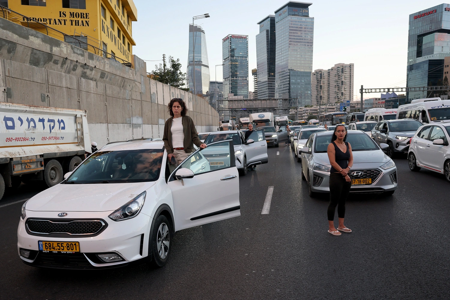 Commuters conduct a moment of silence on the highway as part of a memorial ceremony in Tel Aviv on October 7, 2026, to mark the third anniversary of Hamas's October 7 attack.