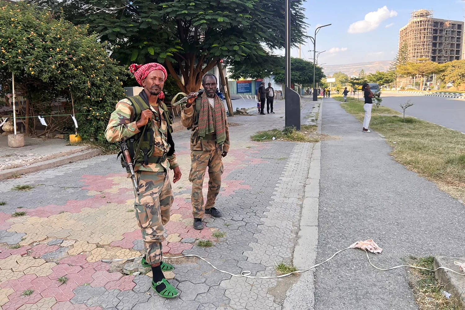 Tigray Peace Force fighters stand in a road after entering Mekelle, in Ethiopia's Tigray region, Sunday, Oct. 4, 2026.