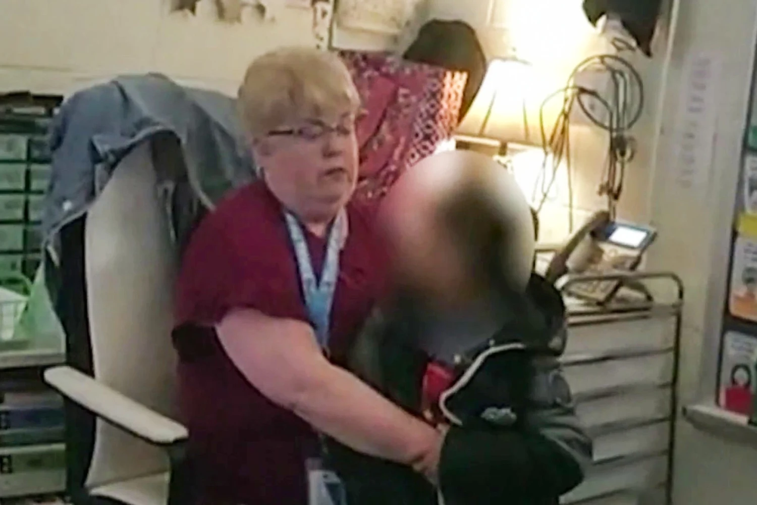 A 6-year-old is apprehended by a teacher after shooting Abigail Zwerner in the chest and hand at Richneck Elementary School in Newport News, Va., on Jan. 6, 2023.