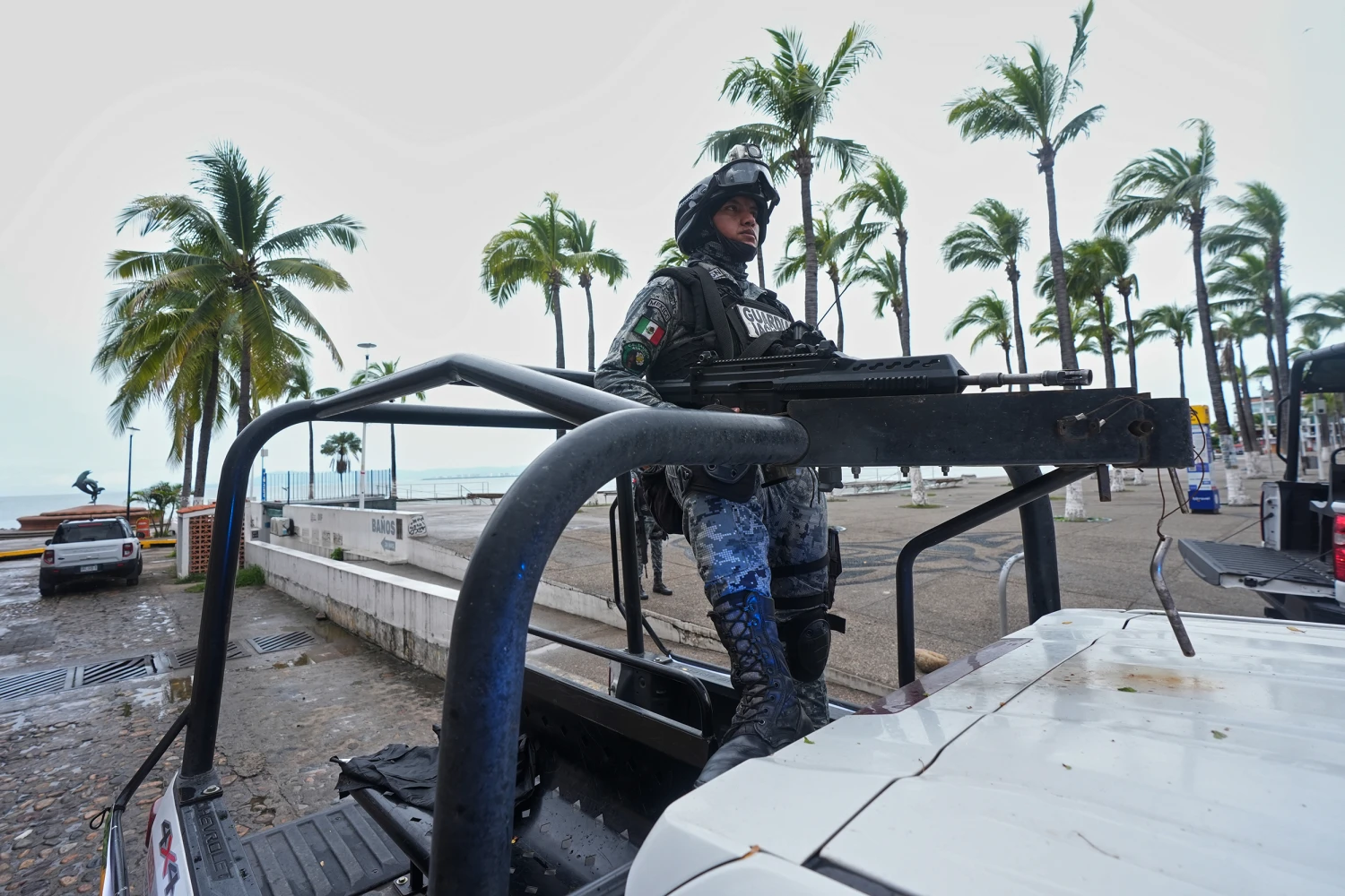 A National Guard patrols along the seawall as Hurricane Simon approaches Puerto Vallarta, Mexico, Sunday, Oct. 11, 2026.