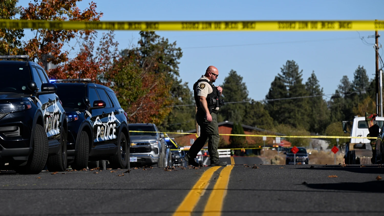 A sheriff's deputy walks outside Silver Rail Elementary school, where a shooting took place, on Thursday, Oct. 15, 2026 in Bend, Ore.