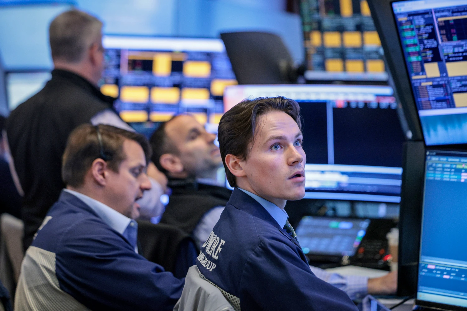 Traders work on the floor of the New York Stock Exchange during morning trading on Oct. 14, 2026, in New York City.