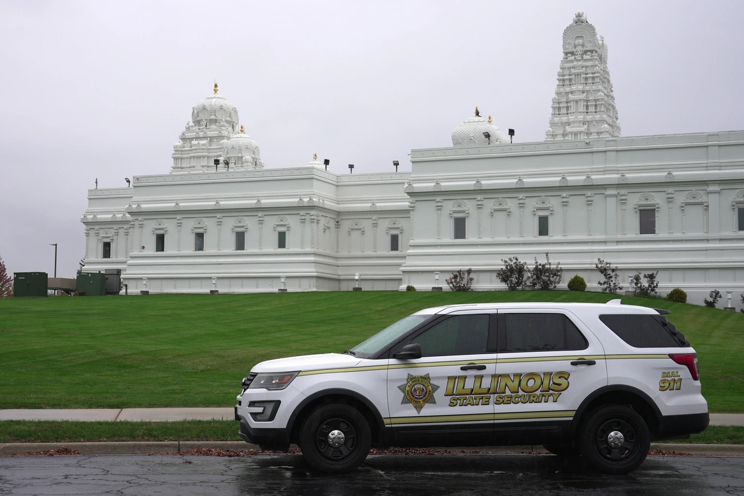 A security vehicle is parked outside of Sri Venkateswara Swami (Balaji) Temple in Aurora, Ill., Thursday, Oct. 15, 2026.