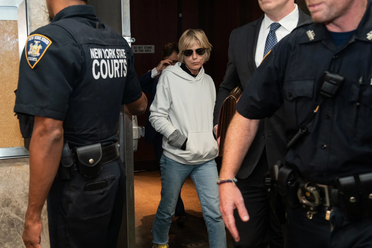 Actress Selma Blair leaves Queens Criminal Court on Monday, October 12, 2026, after a mid-air flight altercation on a plane that landed at JFK Airport in New York City the previous day.