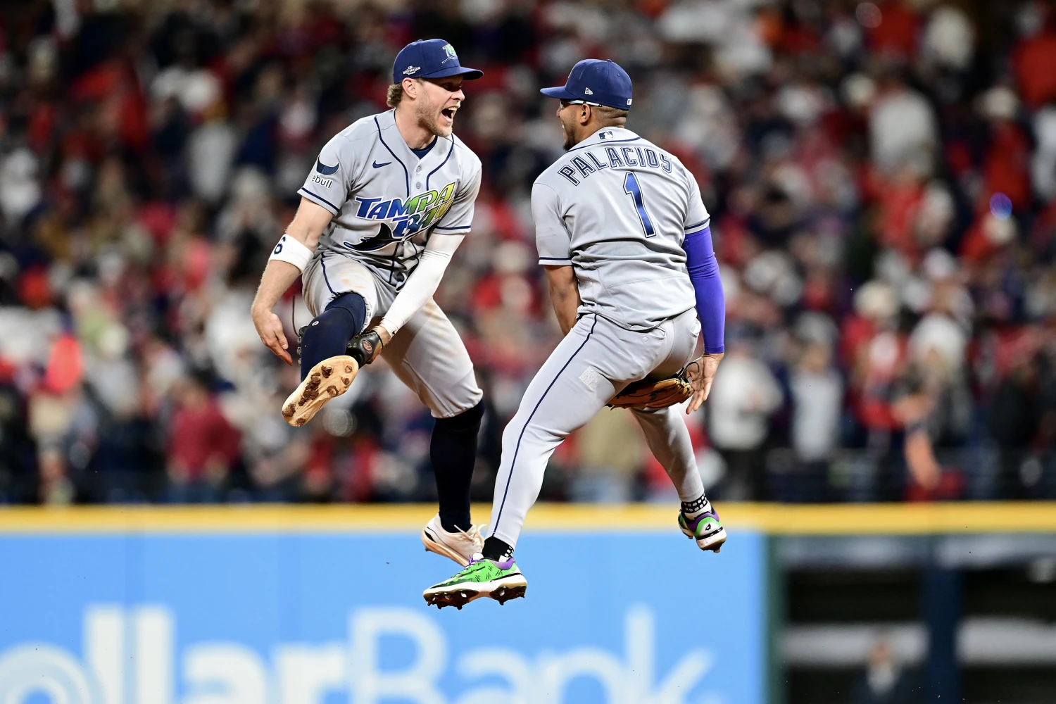 Taylor Walls #6 and Richie Palacios #1 of the Tampa Bay Rays celebrate their 3-1 win over the Cleveland Guardians in game five of the American League Championship Series at Progressive Field on October 18, 2026 in Cleveland, Ohio.