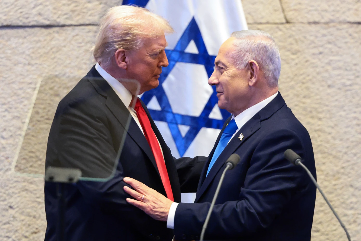 President Donald Trump speaks with Israeli Prime Minister Benjamin Netanyahu at the Knesset, Israel's parliament, on October 13, 2025 in Jerusalem.