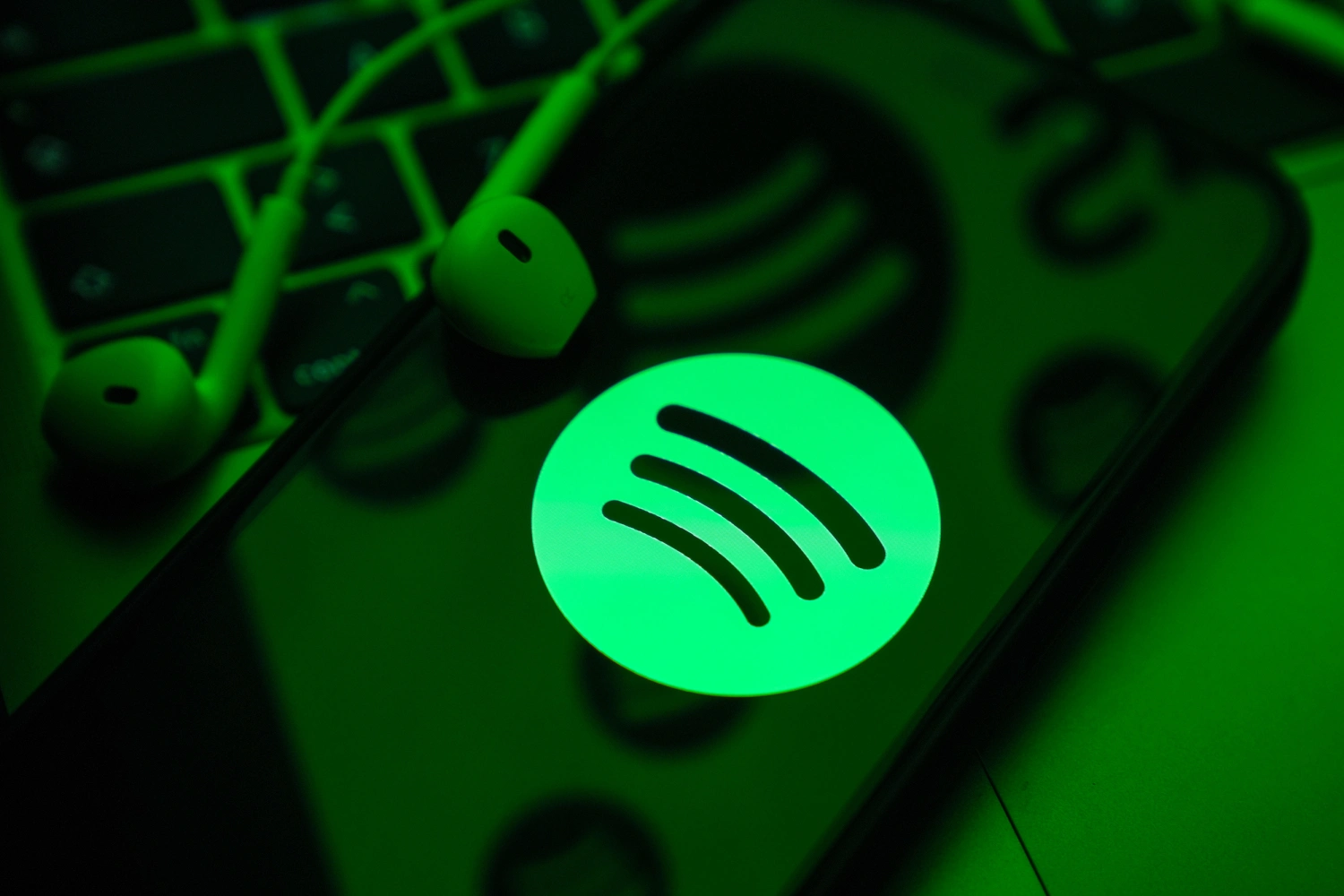 In this photo illustration a mobile phone screen displaying Spotify logo with a headset onto it, in Ankara, Turkiye on May 01, 2024. (Photo by Dilara Irem Sancar/Anadolu via Getty Images)