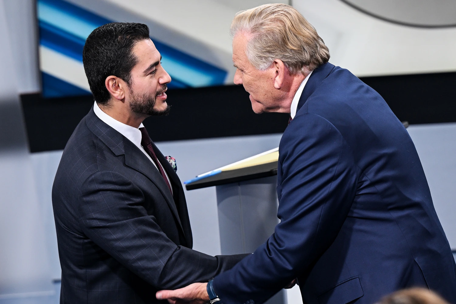 U.S. Senate candidates Democrat Abdul El-Sayed, left, and Republican Rep. Mike Rogers shake hands after their debate.