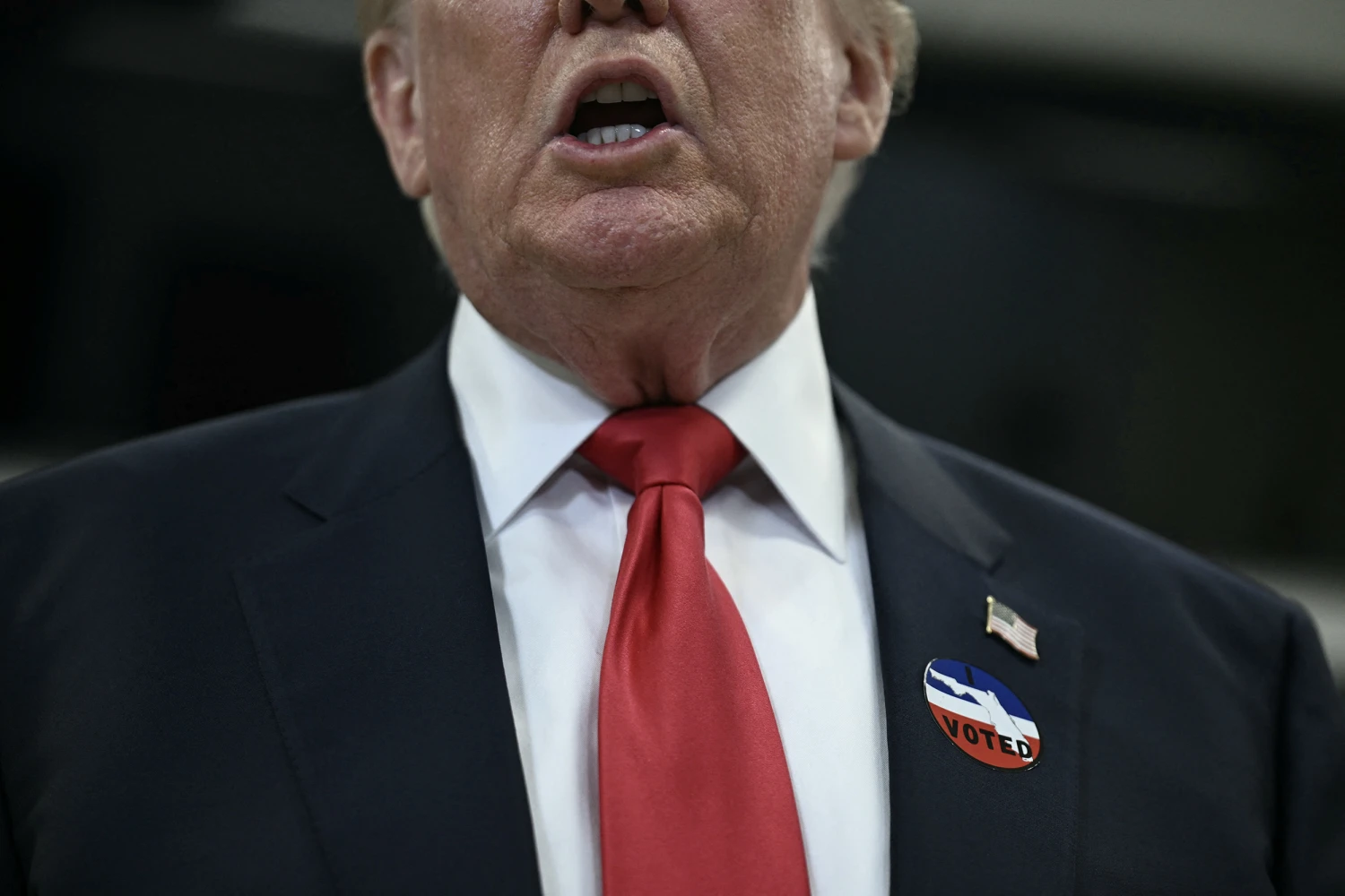President Donald Trump wears an "I Voted" sticker after voting in the midterm elections at the Palm Beach County Supervisor of Elections office in West Palm Beach, Florida, on October 24.