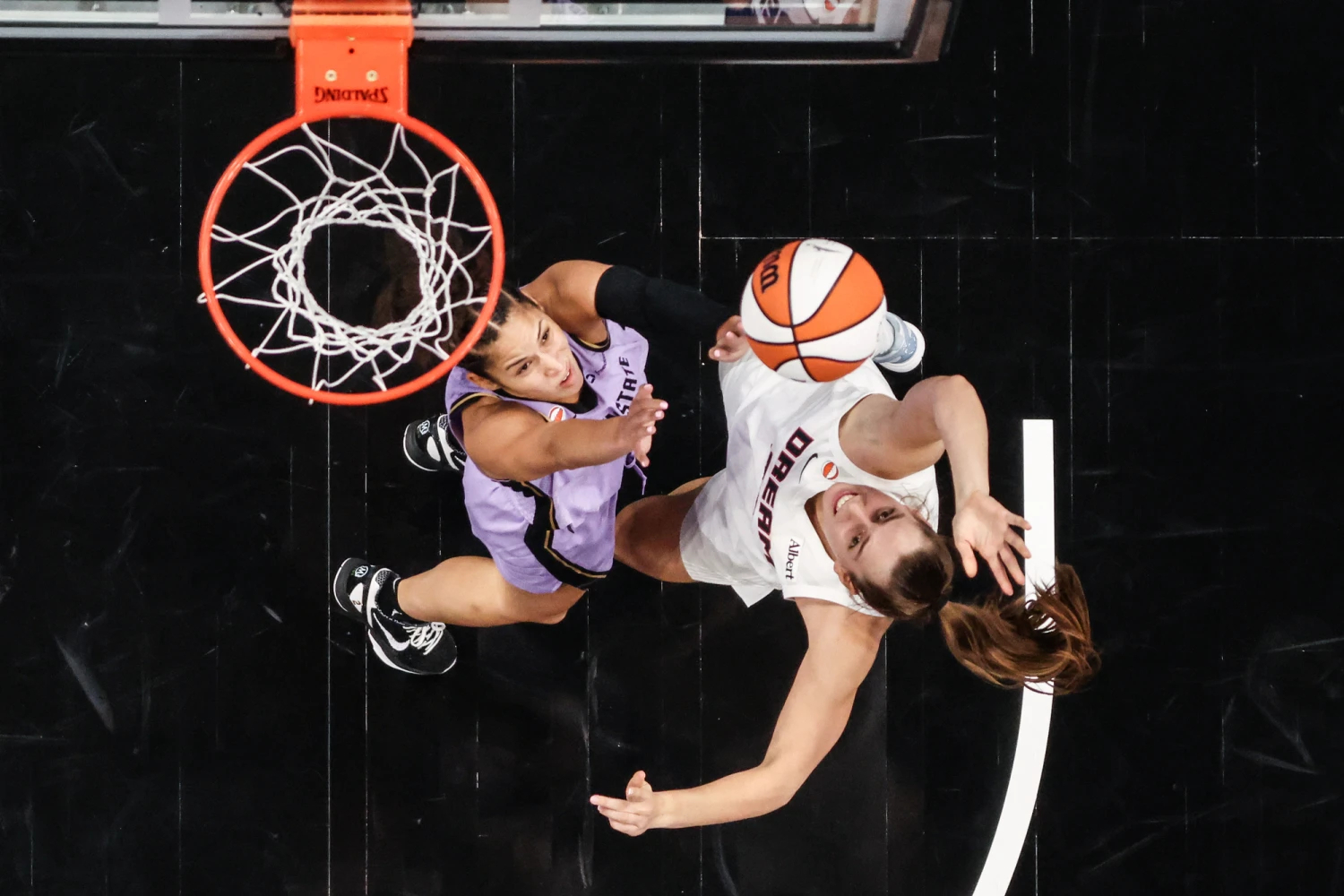 Isobel Borlase of the Atlanta Dream, right, shoots the ball against Veronica Burton of the Golden State Valkyries during the fourth quarter in game four of the 2026 WNBA Finals at State Farm Arena on Oct. 24, 2026, in Atlanta.