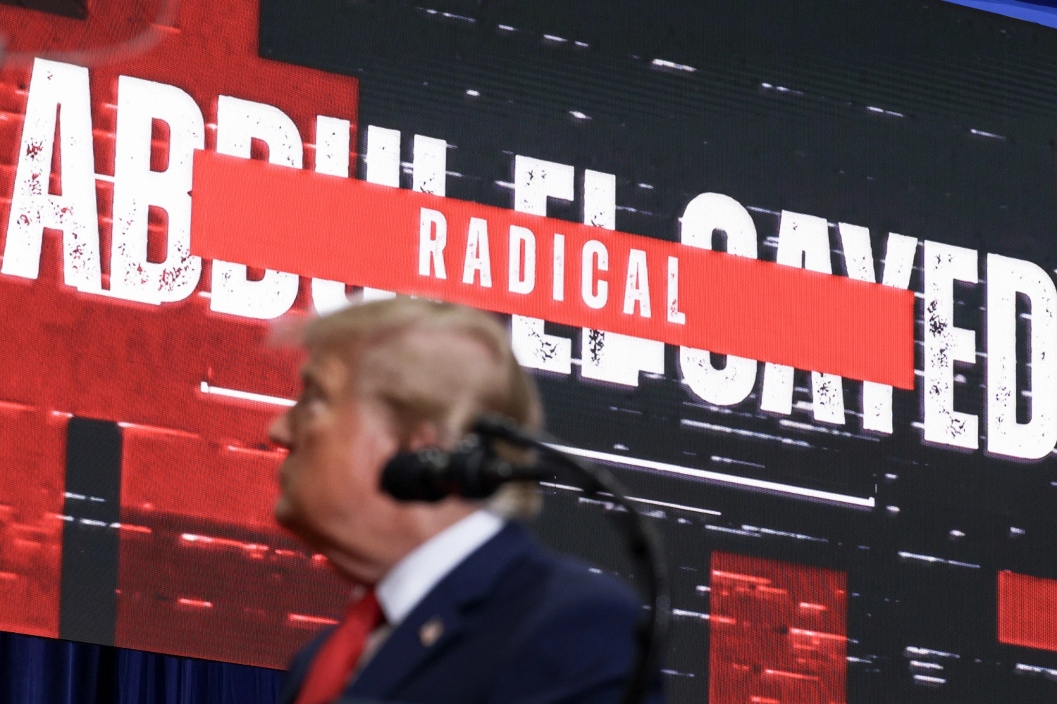 A video of Michigan Democratic Senate candidate Abdul El-Sayed displayed behind President Donald Trump during an election rally on Oct. 25, 2026 in Port Huron, Michigan. Trump is in Michigan to rally for local Republican candidates ahead of next week's midterm elections.