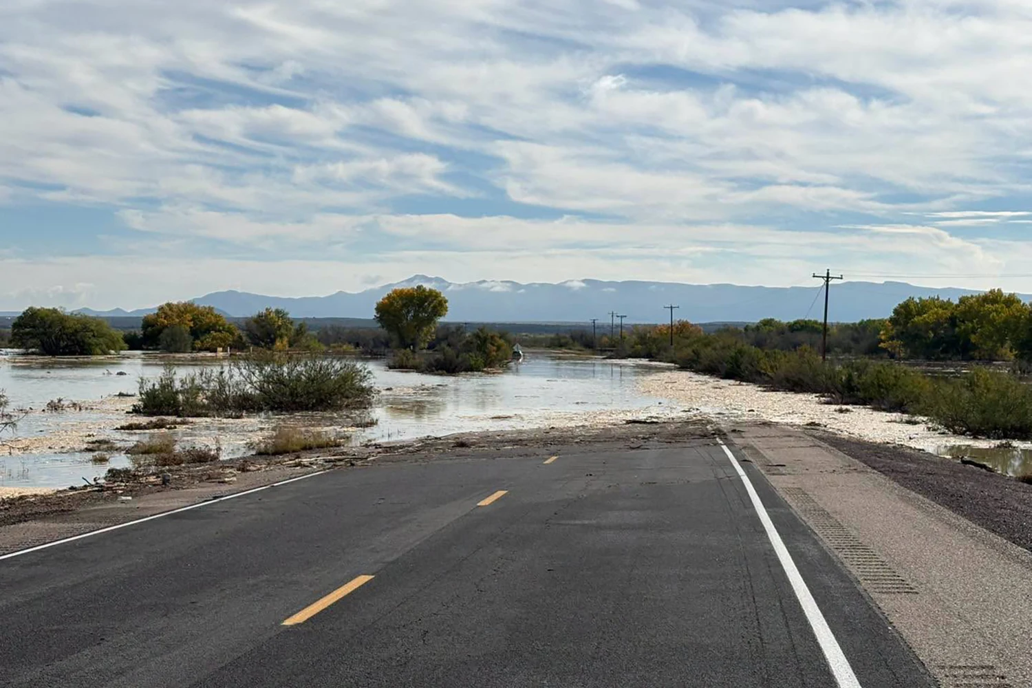 Flooding from the Rio Puerco has overtaken parts of the roadway in northern Socorro County, New Mexico.