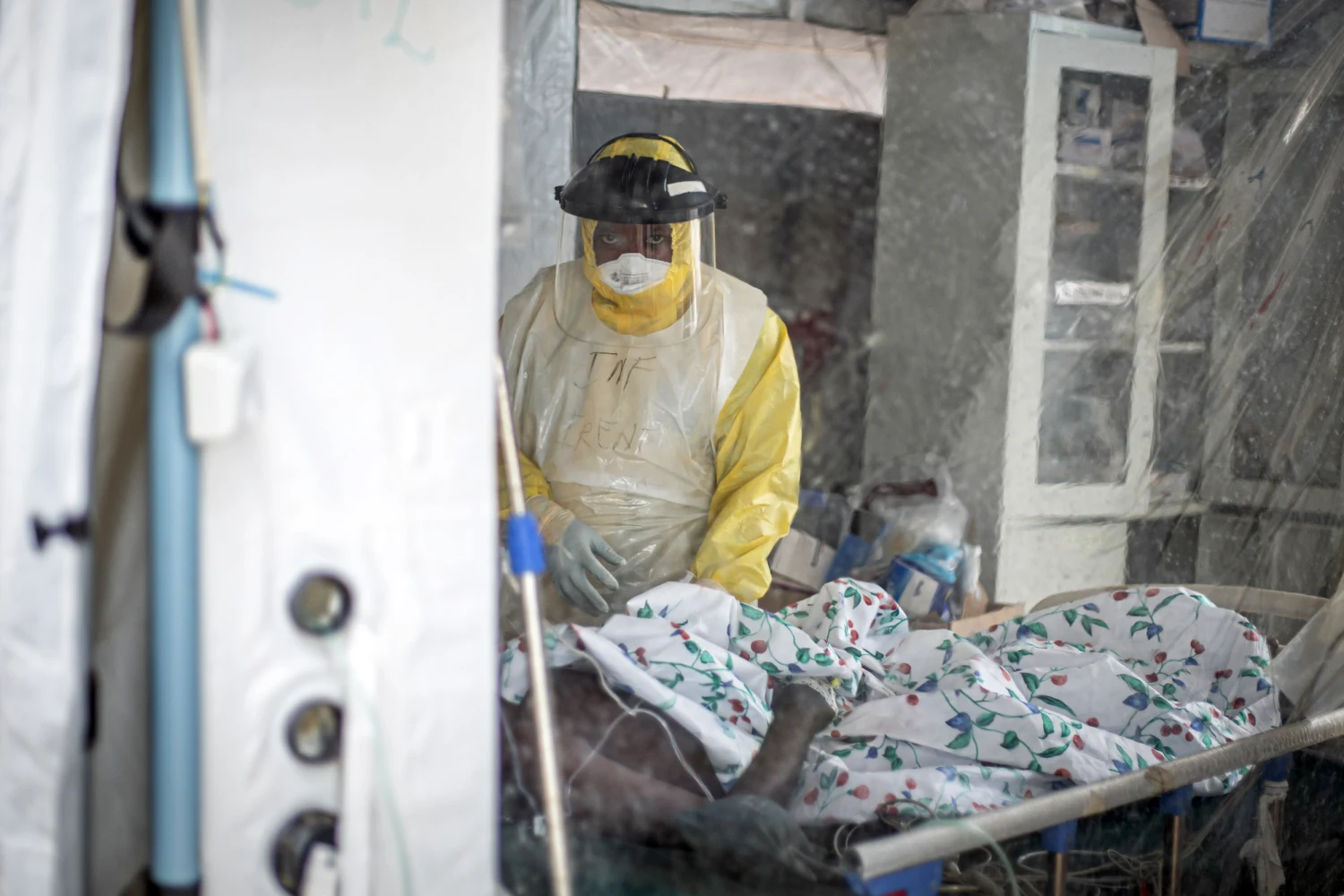 A medical worker checks an infected patient at an Ebola treatment center in Bunia, capital of Ituri Province in the Democratic Republic of the Congo DRC, on Oct. 18, 2026.