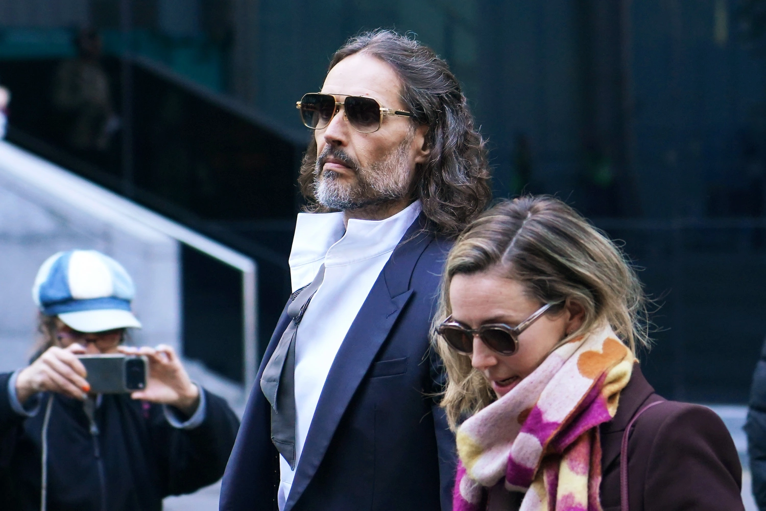 Russell Brand and wife Laura Brand arrive at court ahead of his trial, where he faces rape and sexual assault charges at Southwark Crown Court on October 28, 2026 in London, England.
