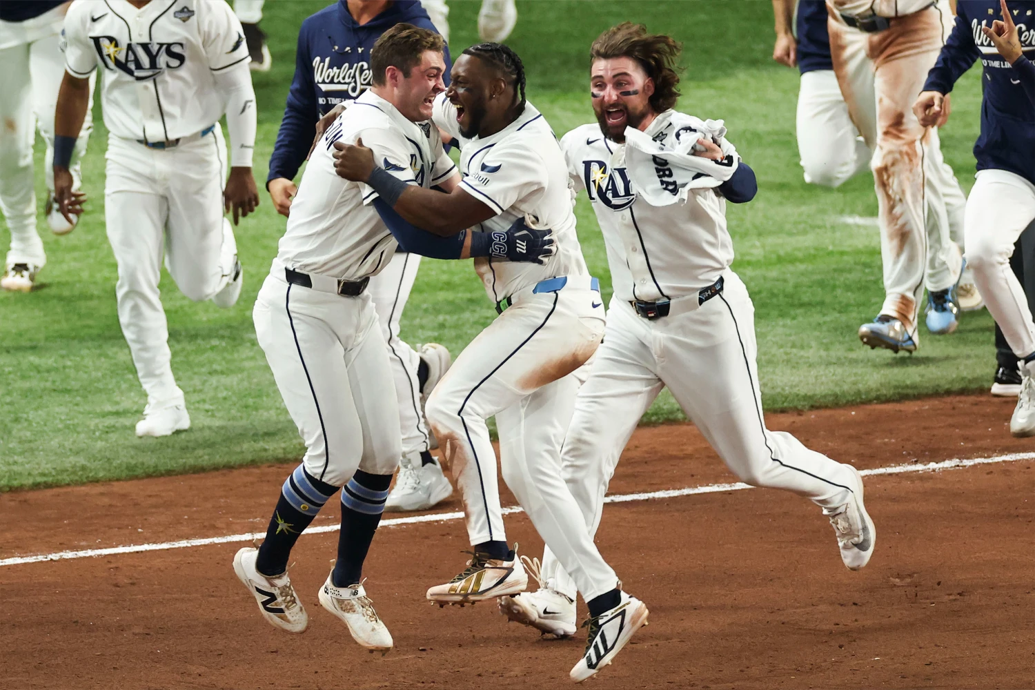 ST. PETERSBURG, FL - OCTOBER 27: Ben Williamson #15 of the Tampa Bay Rays celebrates with Jorge Mateo #9 and Ryan Vilade #26 after hitting a walk-off single during Game Four of the 2026 World Series presented by Capital One between the Milwaukee Brewers and the Tampa Bay Rays at Tropicana Field on Tuesday, October 27, 2026 in St. Petersburg, Florida.