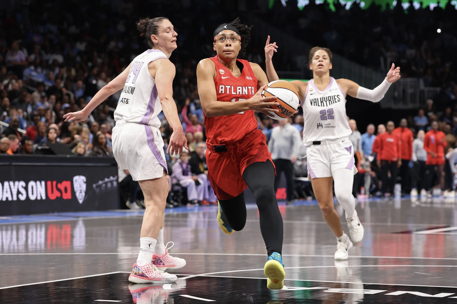 Allisha Gray #15 of the Atlanta Dream drives to the basket between Cecilia Zandalasini #24 and Veronica Burton #22 of the Golden State Valkyries during the second quarter in game six of the 2026 WNBA Finals at State Farm Arena on October 29, 2026 in Atlanta, Georgia.