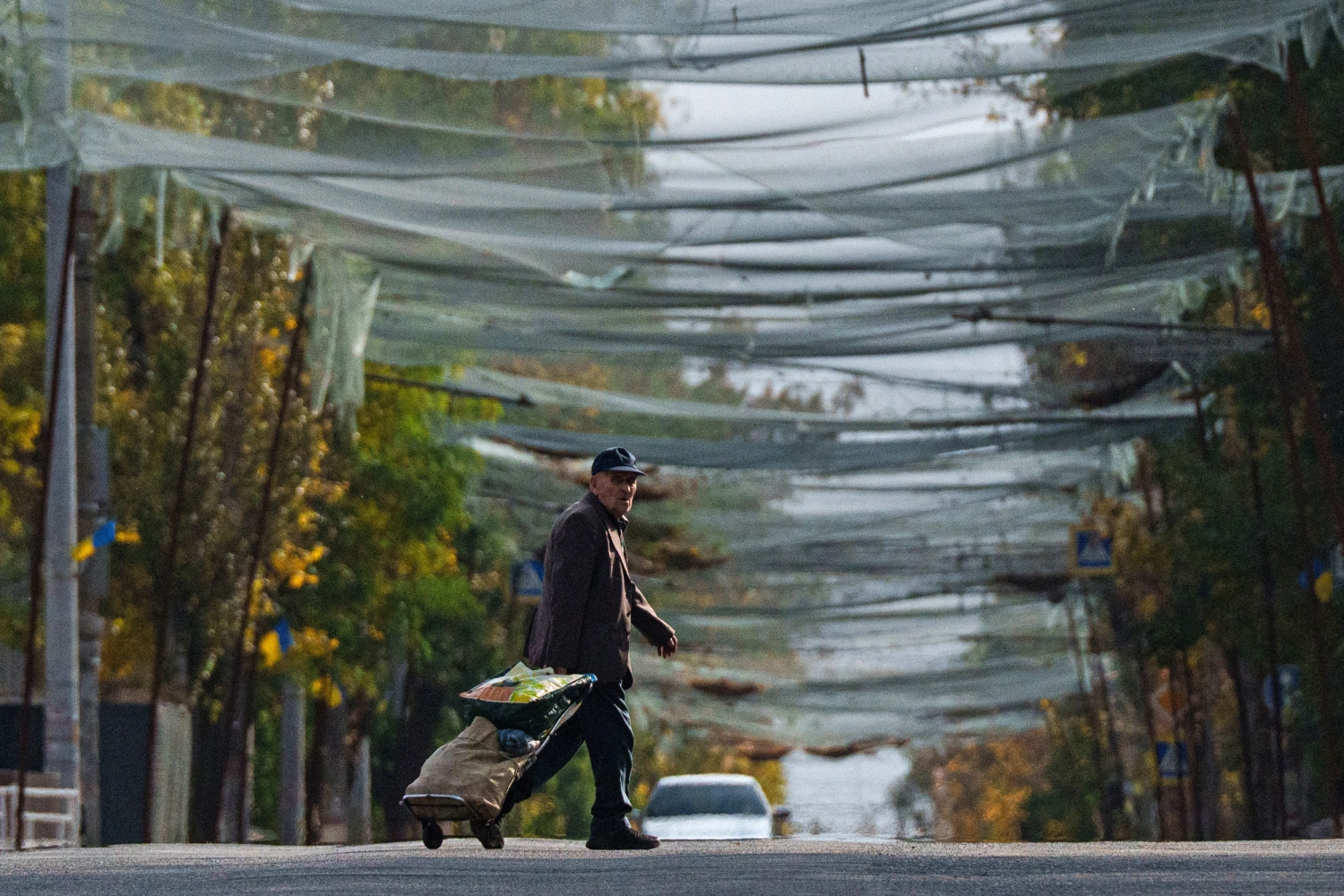 Anti-drone nets are stretched over a street in Oleshky, Ukraine, on Wednesday, Oct. 28, 2026.