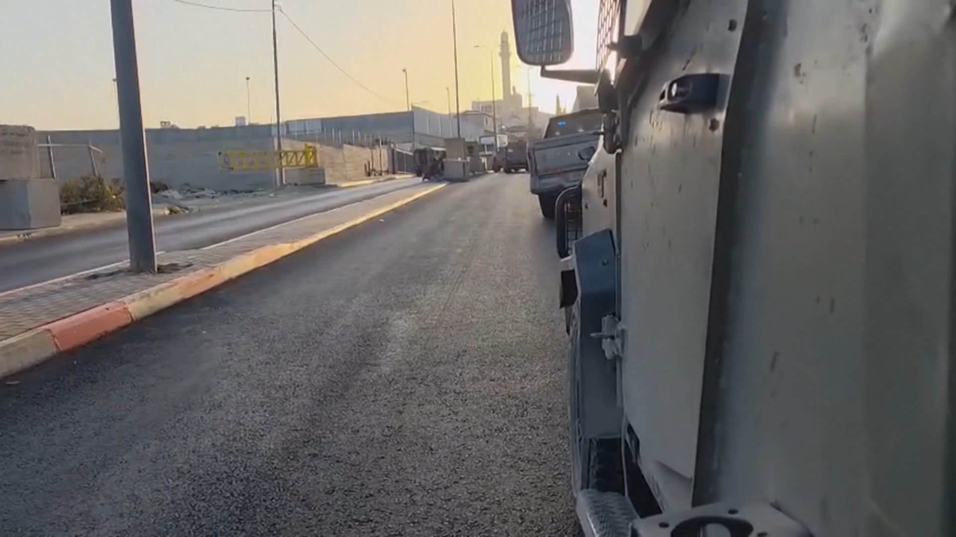 Israeli soldiers exchanged gunfire with a gunman at a checkpoint near Hebron in the occupied West Bank on Friday. In video obtained by Reuters, gunfire can be heard as an ambulance stands by.