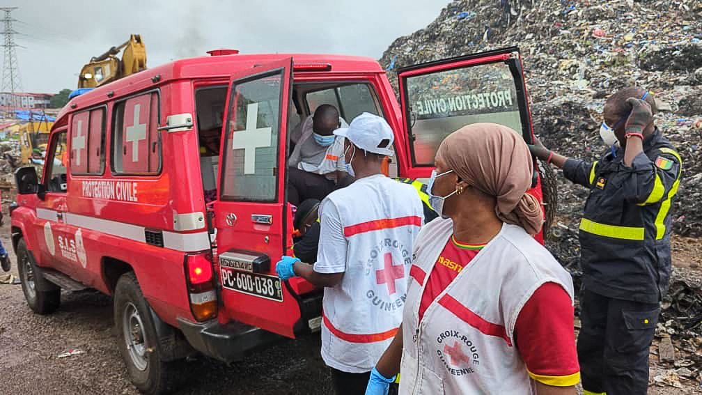 Rescue workers pulled victims from the rubble of landslide at a landfill in Guinea's capital Conakry early Sunday morning.