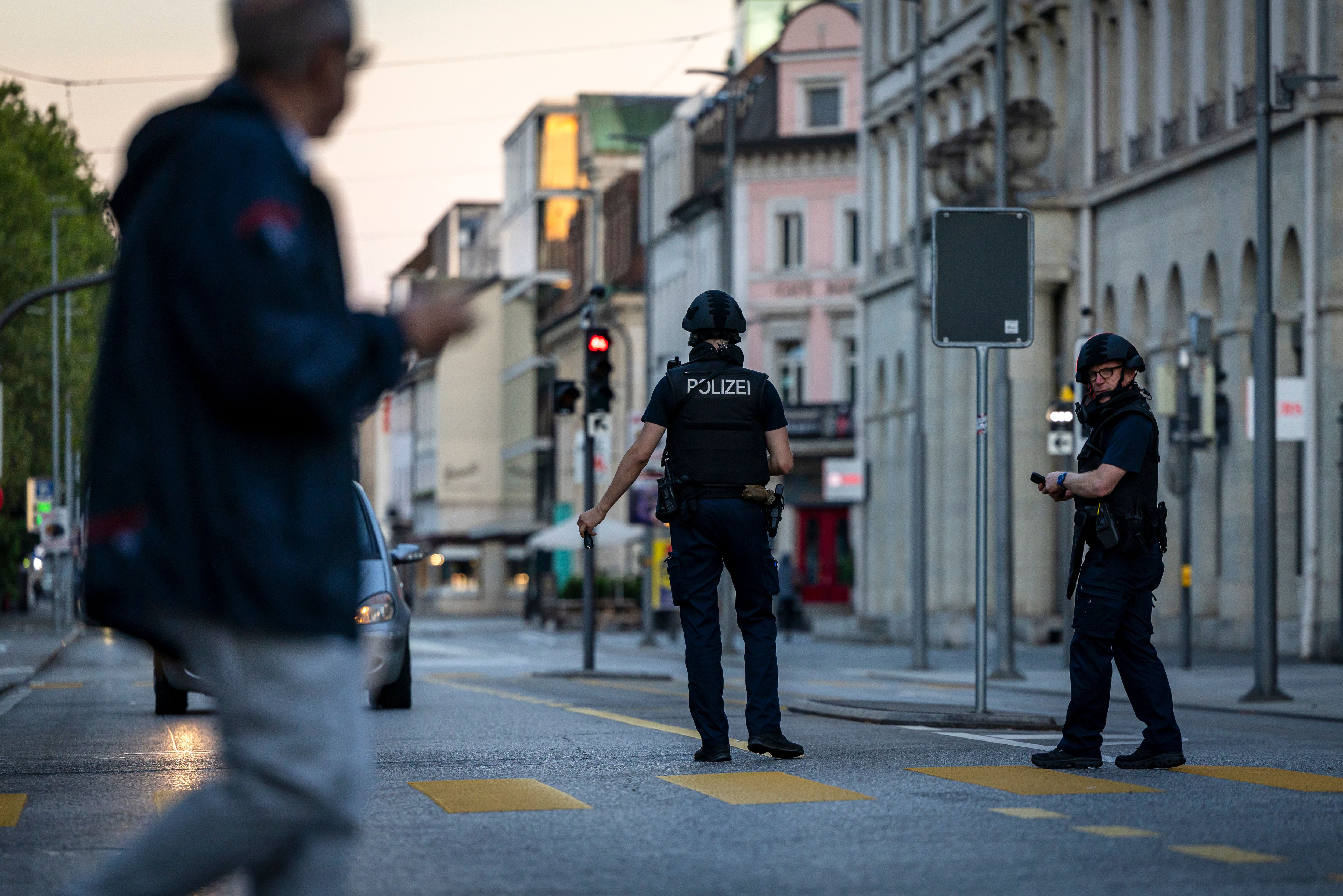 Police officers patrol a street following a shooting at a rave in downtown Aarau, Switzerland, on August 30, 2026.