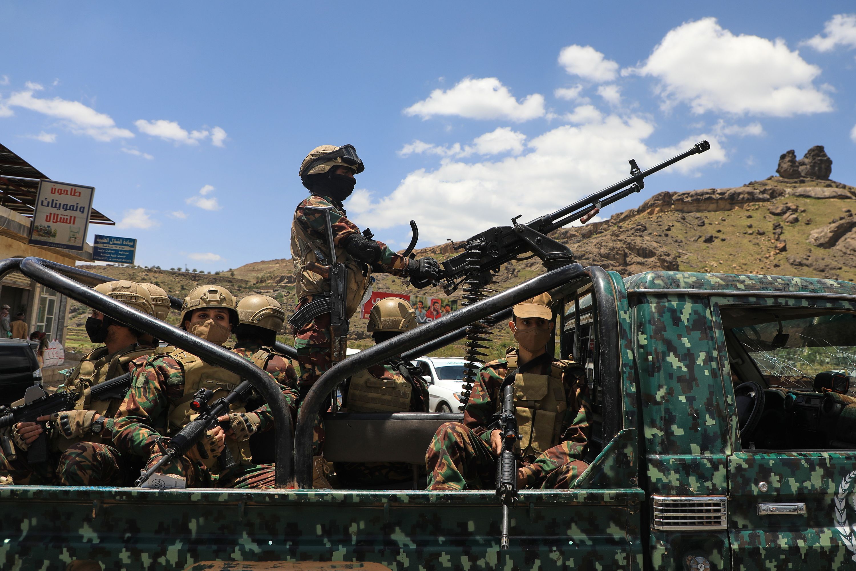 Houthi fighters escort a convoy carrying prisoners freed in Mokha through the Bani Matar district on its way to Sanaa, Yemen, on Saturday, September 12, 2026,  following the Houthi takeover of the southern Red Sea port city.