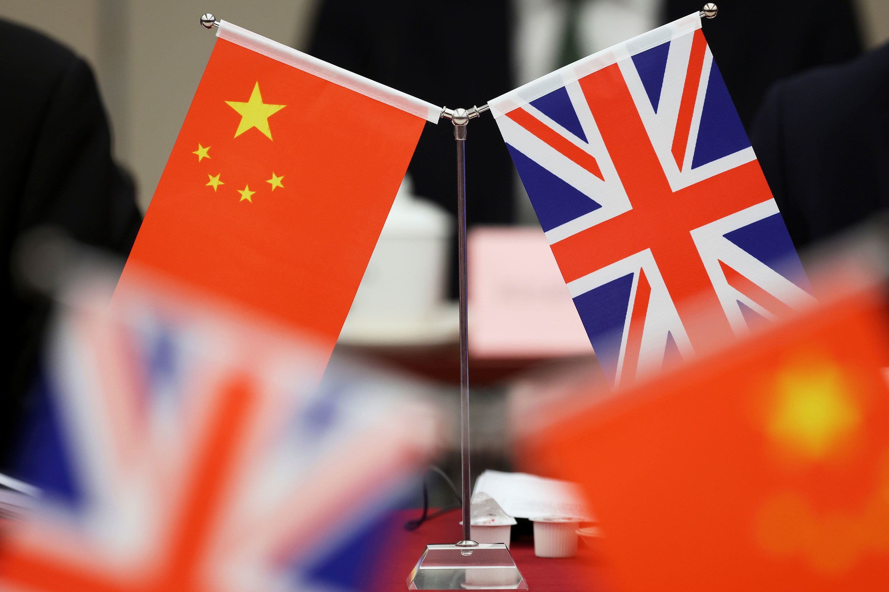 Flags of China and the Union Jack stand during the China-UK Energy Dialogue in Beijing, China, March 17, 2025. (