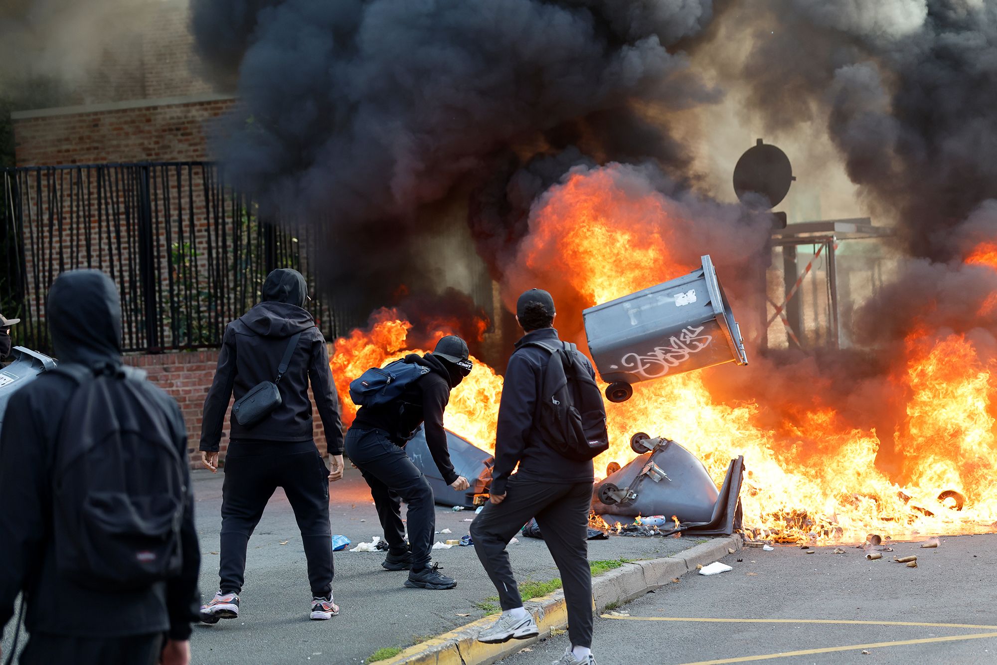 Students burn garbage as they protest to demand more resources at school, in Lille, France, Thursday, Oct. 1, 2026. (AP Photo/Jean-Francois Badias)