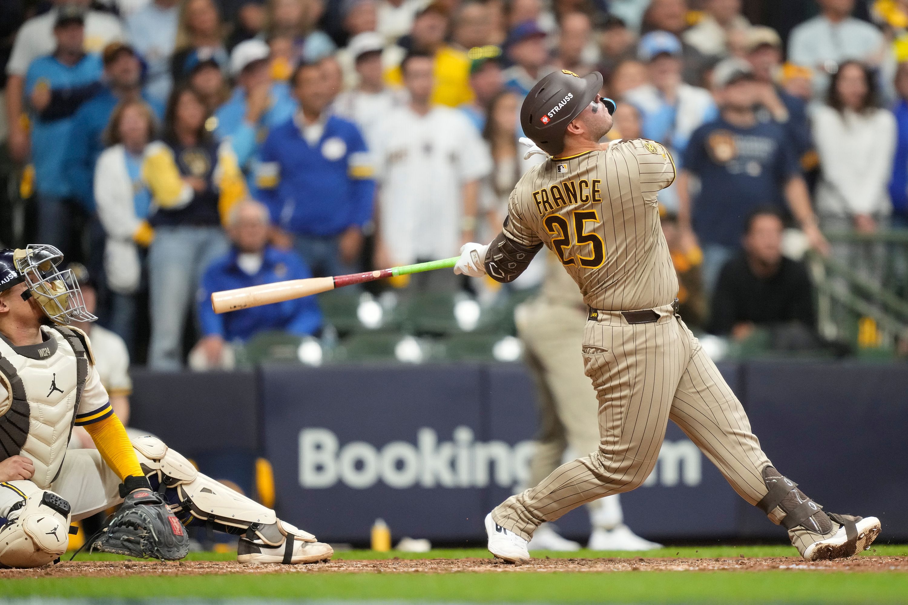 San Diego Padres' Ty France hits a ball that hit a cable near the roof in the ninth inning on Saturday in Milwaukee, Wisconsin.