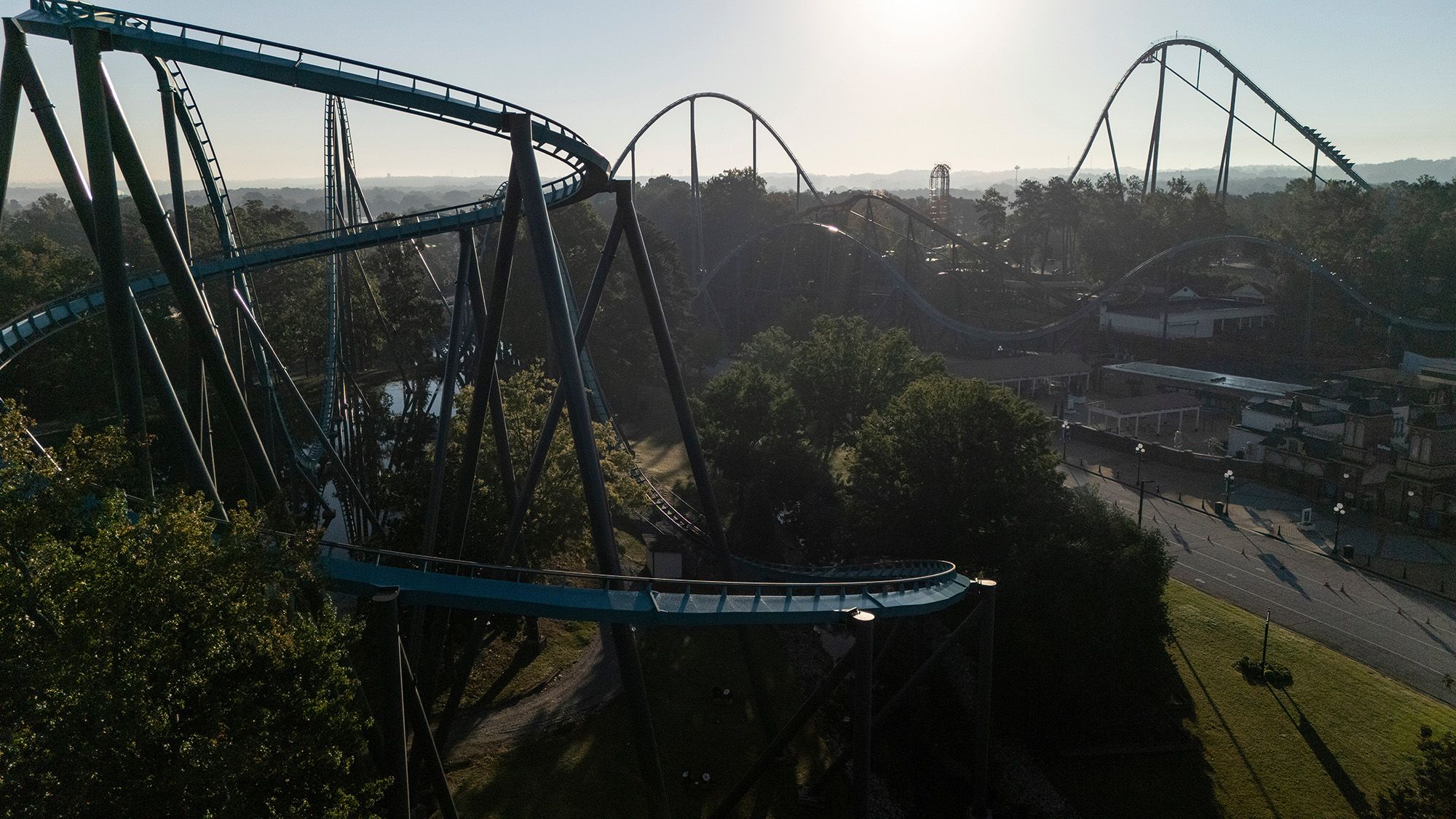 Attractions at Six Flags Over Georgia, about 15 miles northwest of Atlanta, on Tuesday. A death on one of its rides on Monday prompted the financially troubled company to shut nine rides at parks across the country.