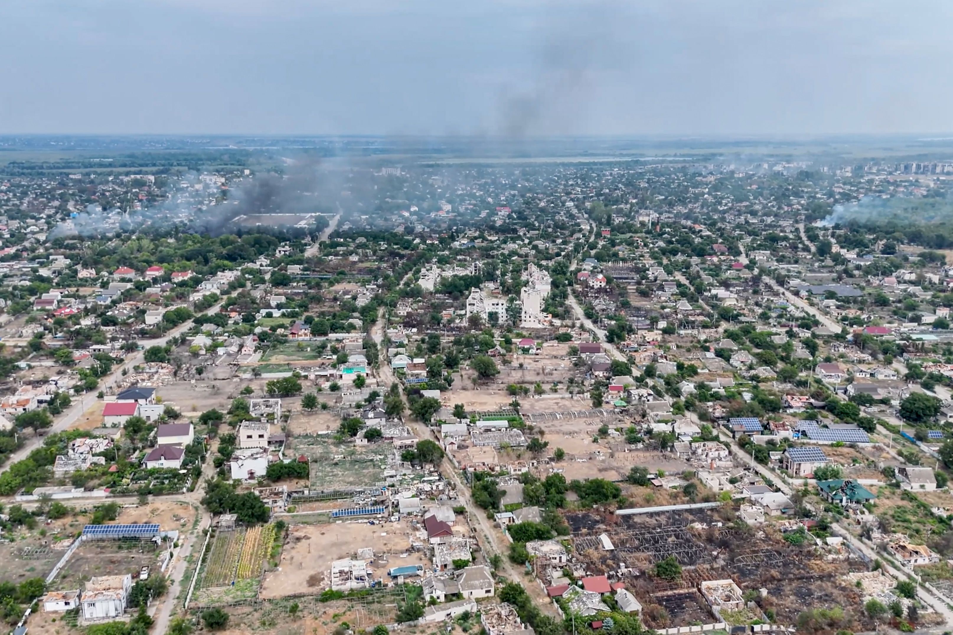 Smoke rises from a residential neighborhood in the Russian-occupied city of Oleshky in the Kherson region of Ukraine on September 22, 2026.