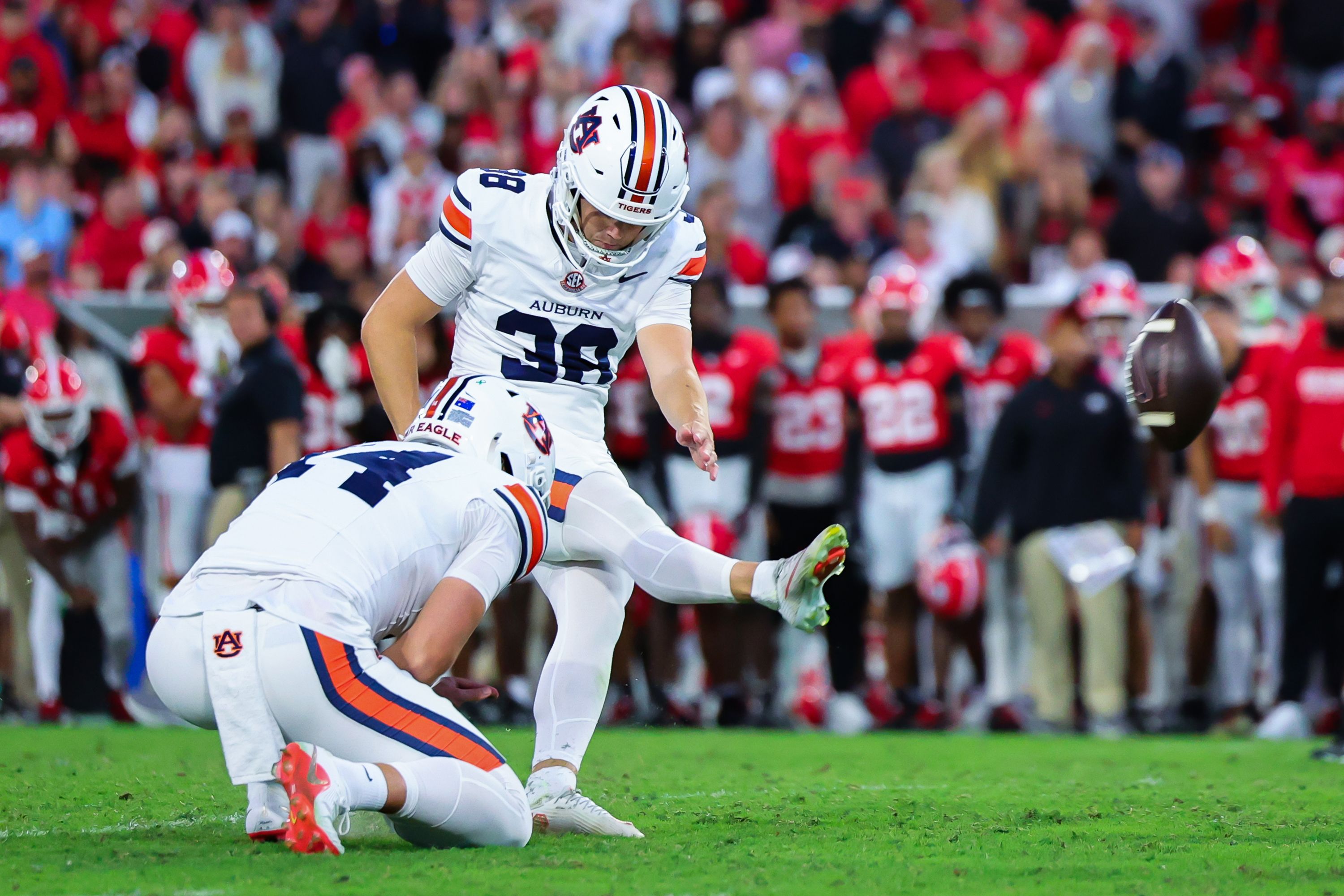 Auburn kicker Alex McPherson kicks the game-winning field goal as time expired in the second half of an NCAA college football game against Georgia on Saturday.