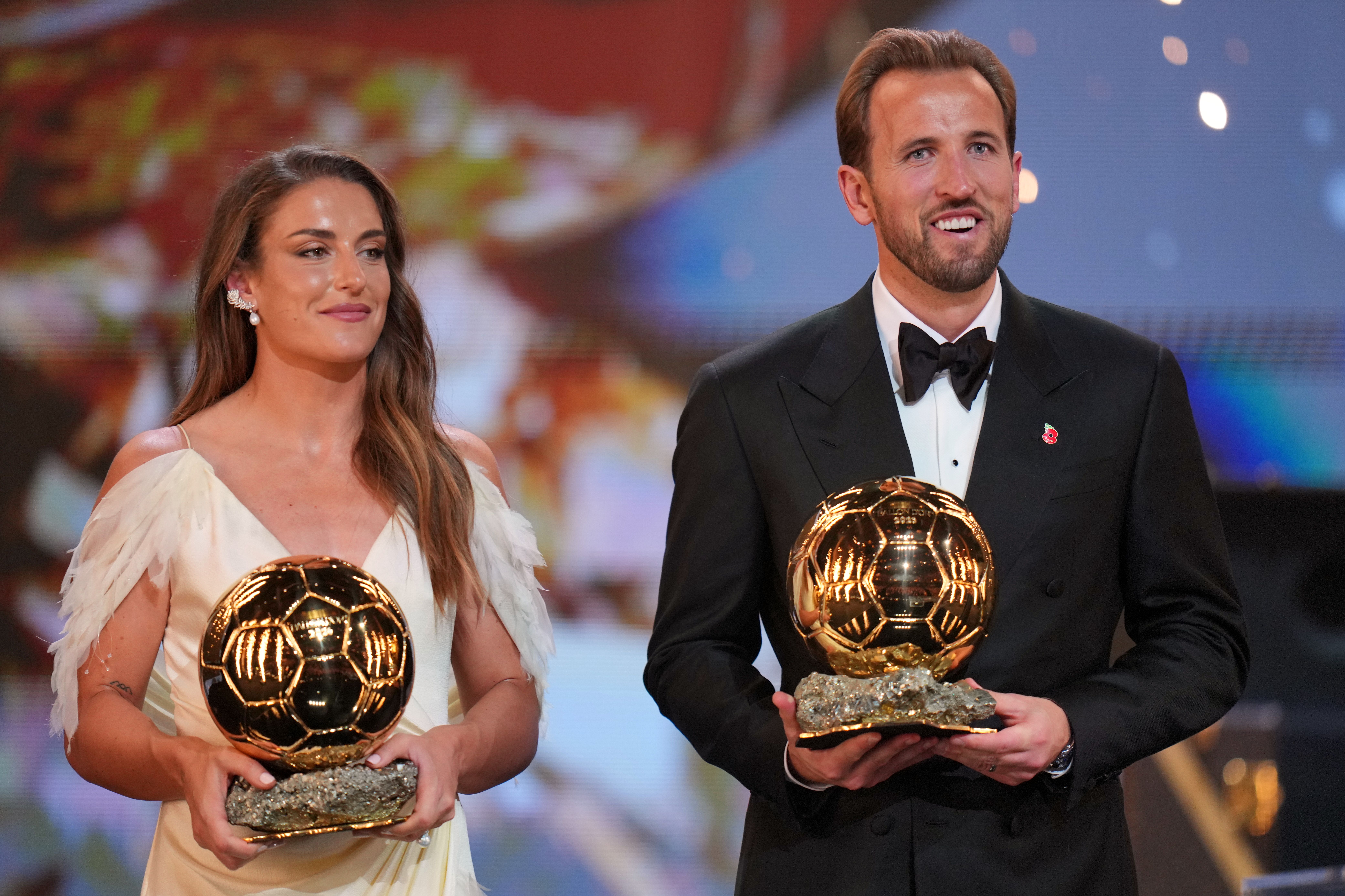 England's soccer player Harry Kane and Spain's Alexia Putellas win the player of the year trophy during the Ballon d'Or ceremony at the London Palladium Theatre in London, England, Monday, Oct. 26, 2026 . (AP Photo/Kin Cheung)