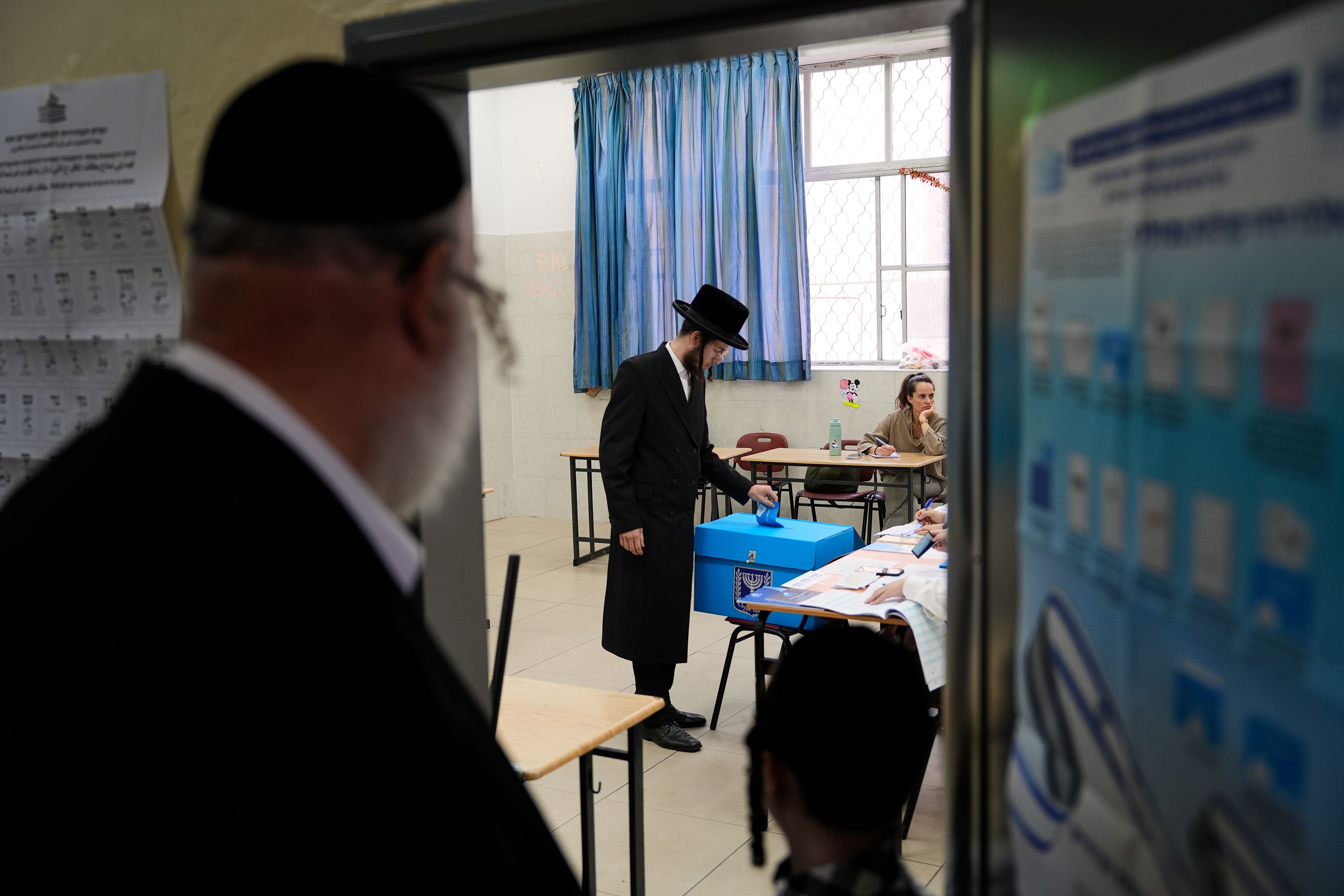 A man casts his ballot at a polling station during Israel's general election in Haifa, Israel, Tuesday, Oct. 27, 2026.