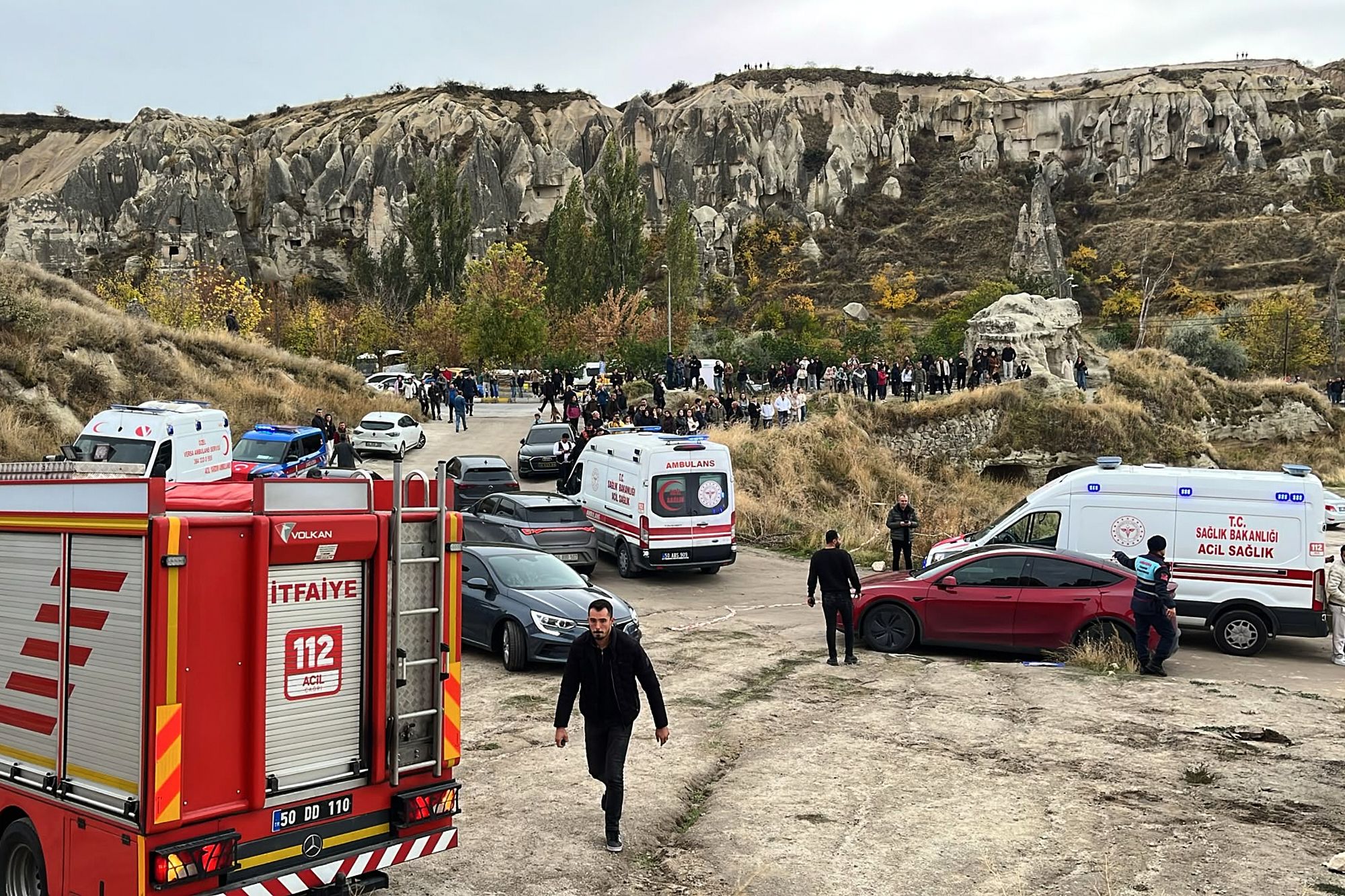Emergency teams work in the aftermath where parts of a volcanic rock formation collapsed in Cappadocia, central Turkey, Thursday, Oct. 29.
