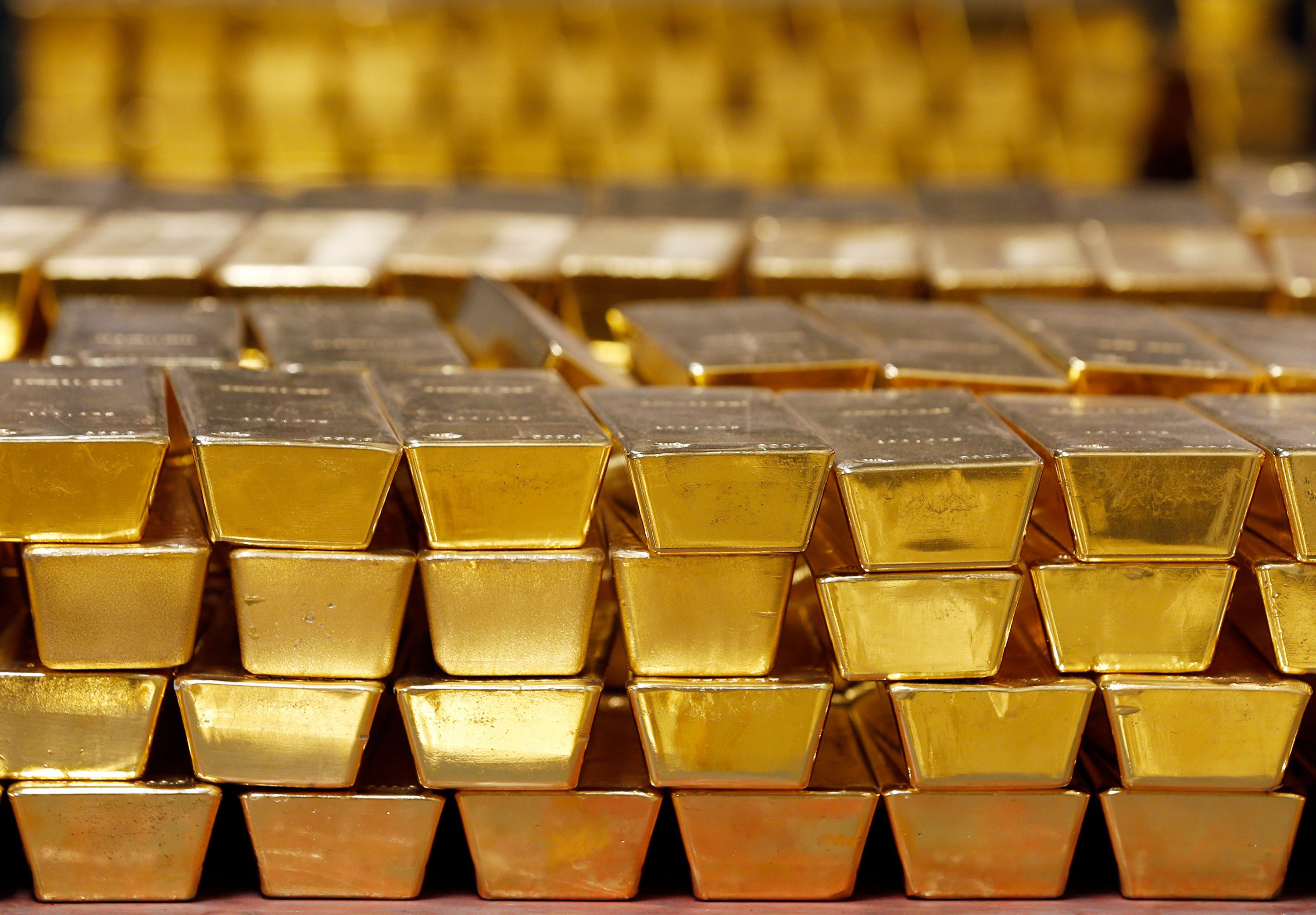 Gold bars are stacked in a vault at the United States Mint, in West Point, New York, in 2014.