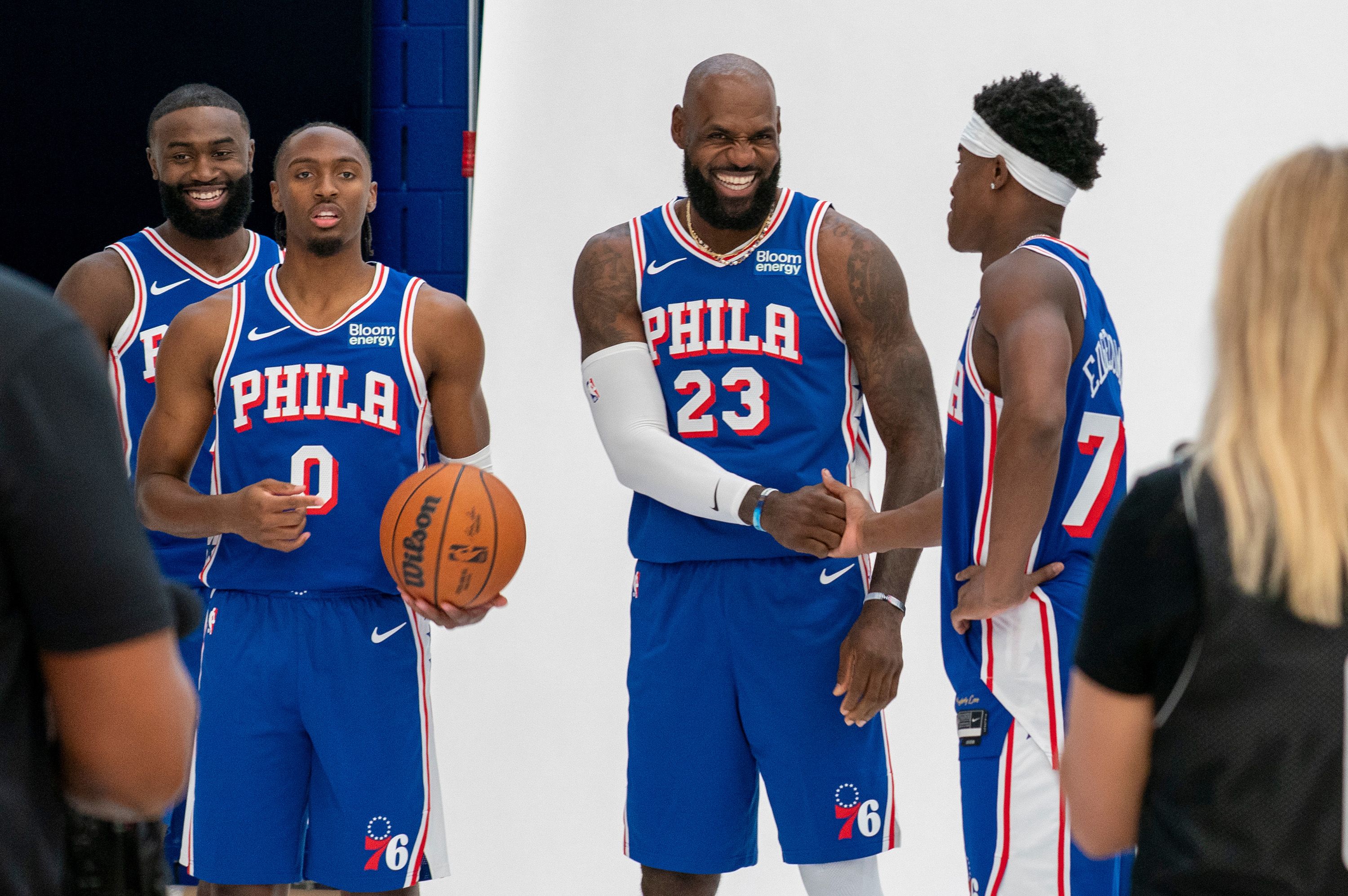 Philadelphia 76ers' LeBron James, center right, greats VJ Edgecombe, right, as they get ready for a group photos with Tyrese Maxey, center left, and Jaylen Brown, left, during the NBA basketball team's media day, in Camden, New Jersey on September 28.