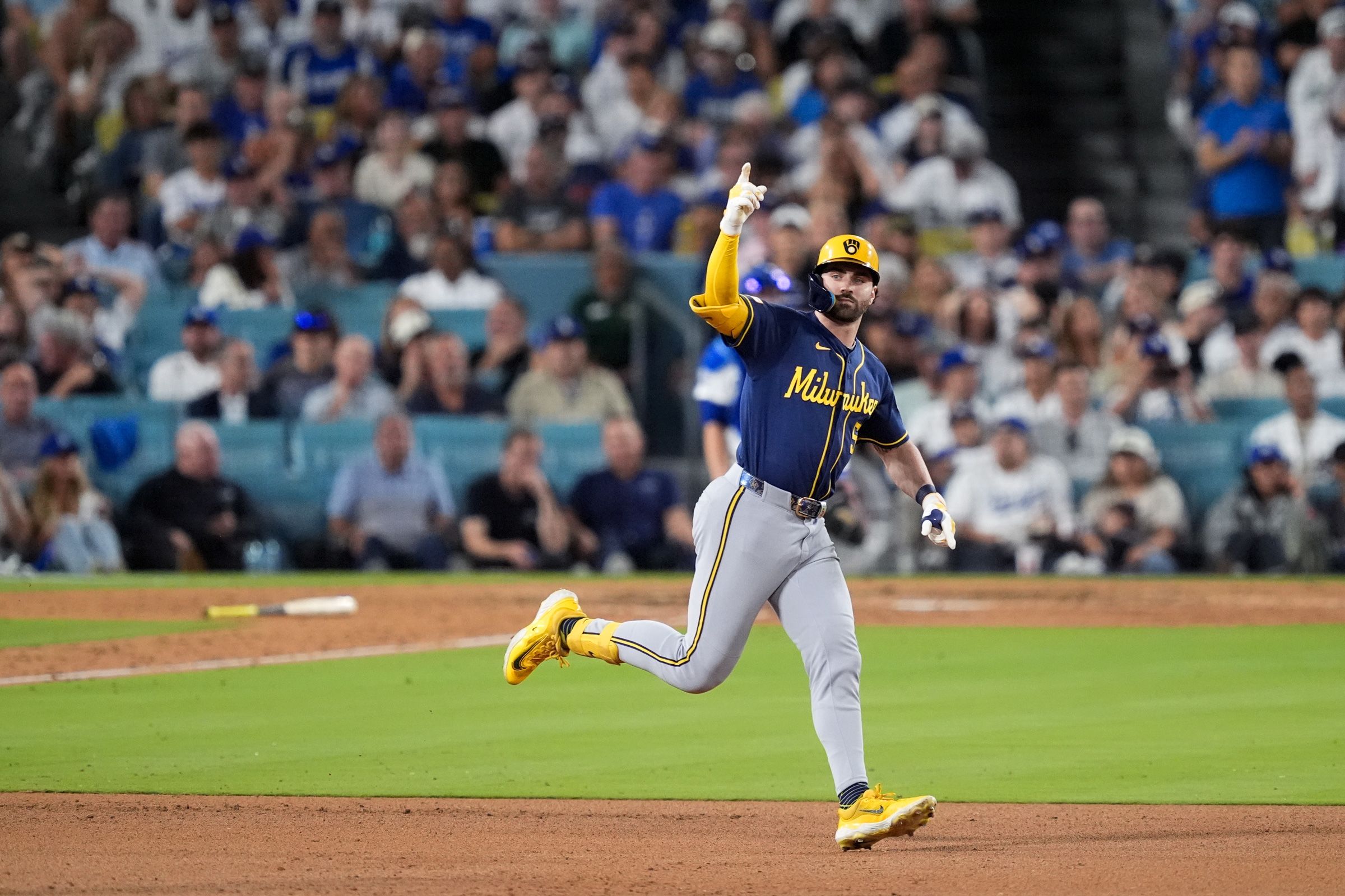 Milwaukee Brewers center fielder Garrett Mitchell celebrates his solo home run during the sixth inning of Game 4 of baseball's National League Championship Series between the Milwaukee Brewers and the Los Angeles Dodgers, Thursday, Oct. 15, 2026, in Los Angeles. (AP Photo/Mark J. Terrill)