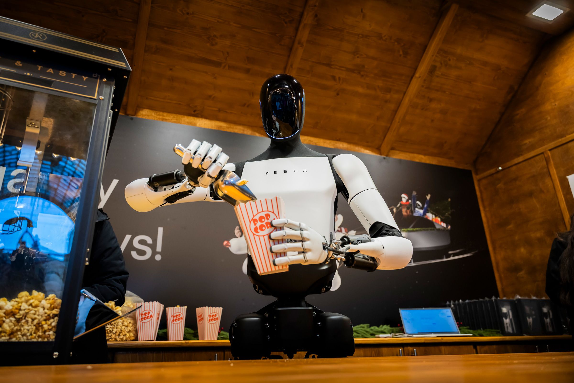 Billionaire Elon Musk's U.S. technology company Tesla today unveiled its humanoid robot "Optimus" at a Berlin shopping mall, where it served popcorn on December 20, 2025.