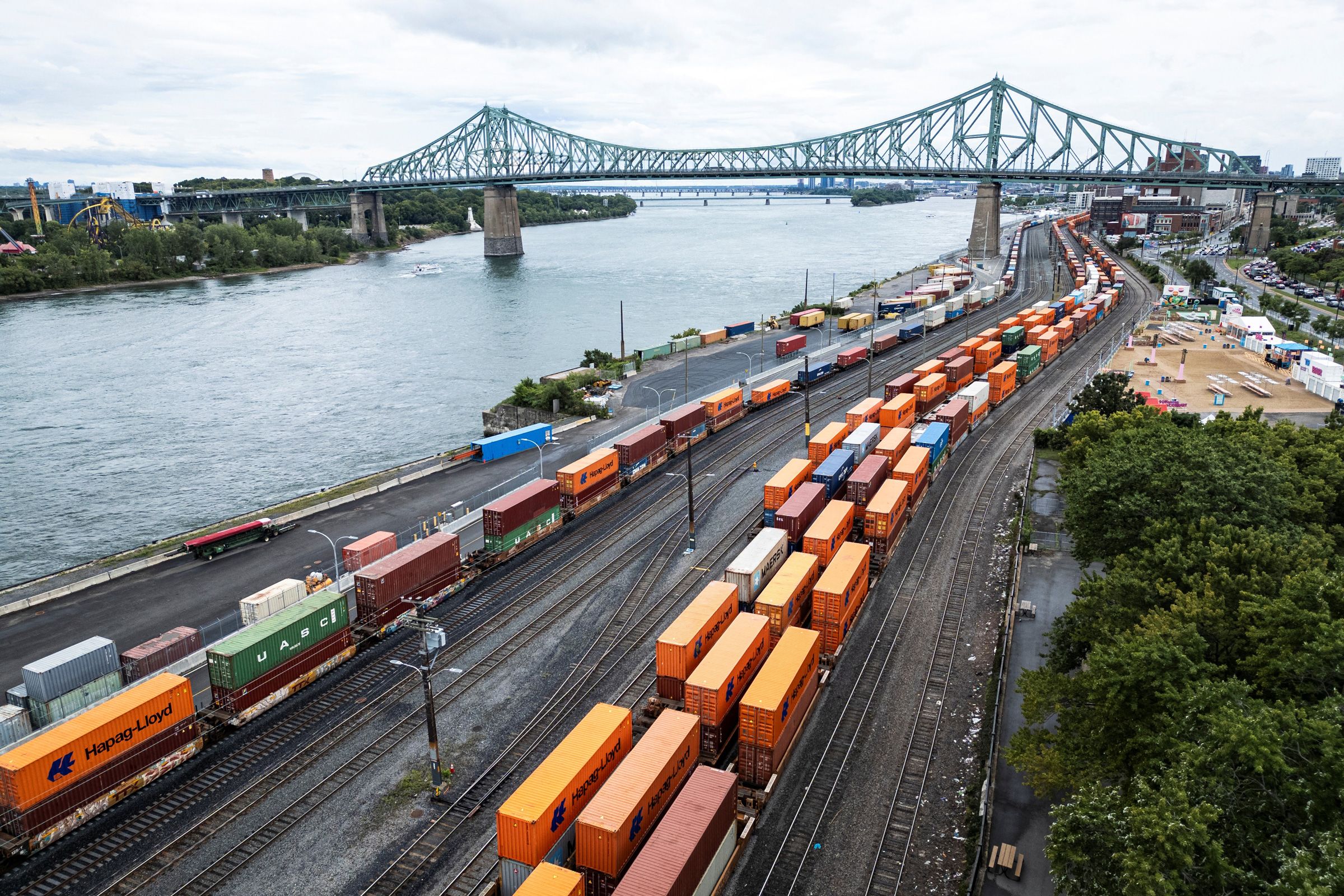 Shipping containers are seen in the Port of Montreal in Montreal, Quebec, on August 23, 2026. Canadian Prime Minister Mark Carney announced retaliatory tariffs on the United States on August 22, after walking away from a "bad deal" on trade in a deepening rift between the longtime allies. Negotiations between the neighboring countries broke down on August 21 in Washington, putting into force new 50-percent US tariffs impacting about $20 billion worth of goods, or 5.5 percent of Canadian exports to the United States. Impacted products range from hockey sticks to cement.