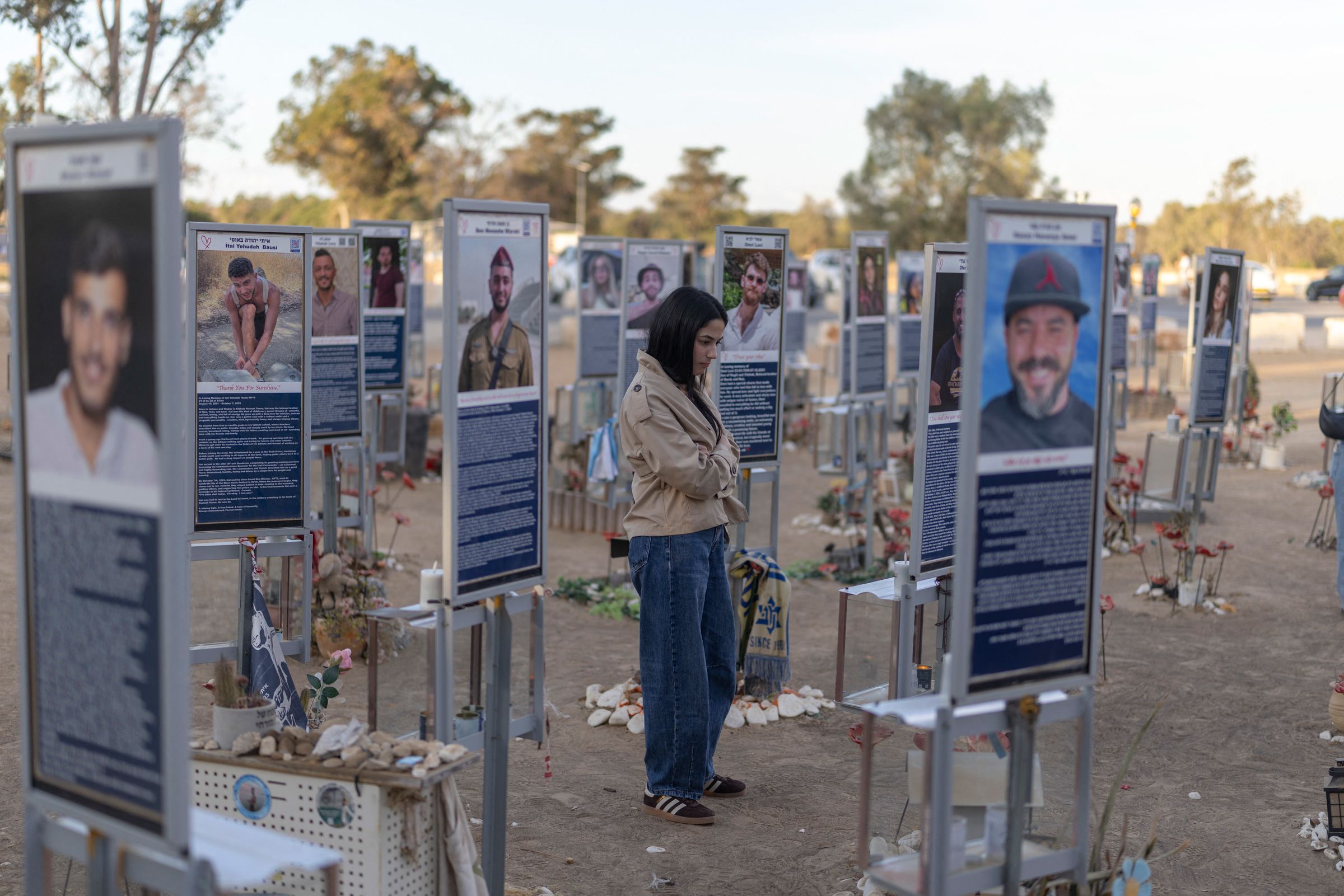 An Israeli woman pays her respects at the memorial to the victims of the 2023 Hamas attacks at the Nova festival site in Reim, southern Israel, on October 6, 2026. Israel's defence minister on October 6 said he had put the military on high alert before the anniversary of Hamas's October 7, 2023 attack, warning Gazans would pay a "heavy price" if forces were harmed.