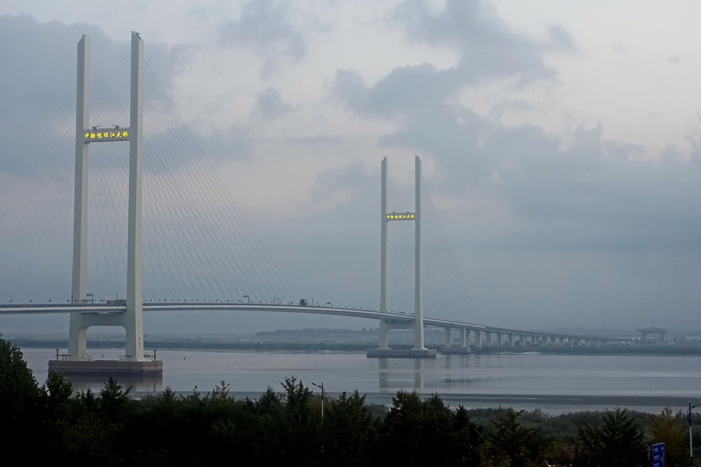 Photo taken from the northeastern Chinese city of Dandong shows the New Yalu River Bridge between China and North Korea on its opening day, Oct. 15, 2026.