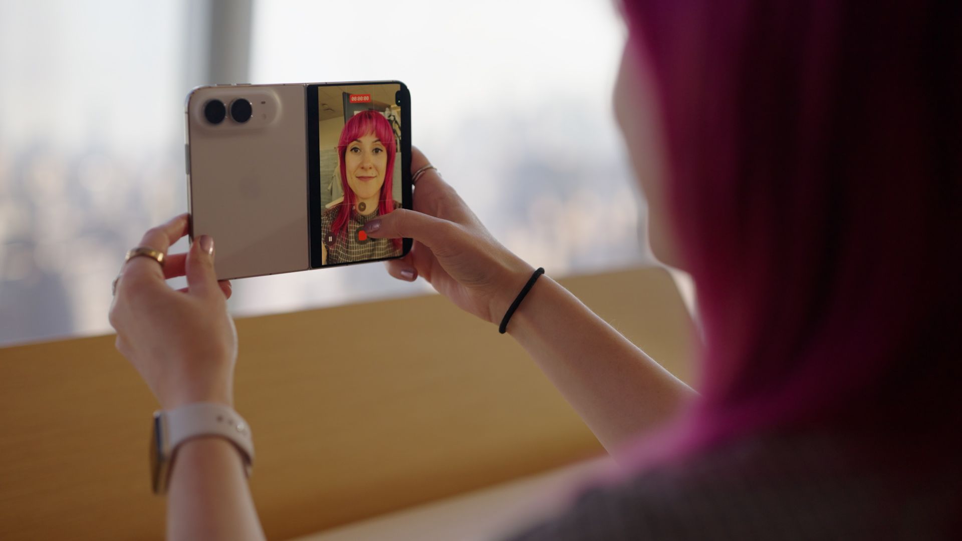 On the iPhone Duo, you can use the rear cameras to take selfies while previewing your shot on the front screen.