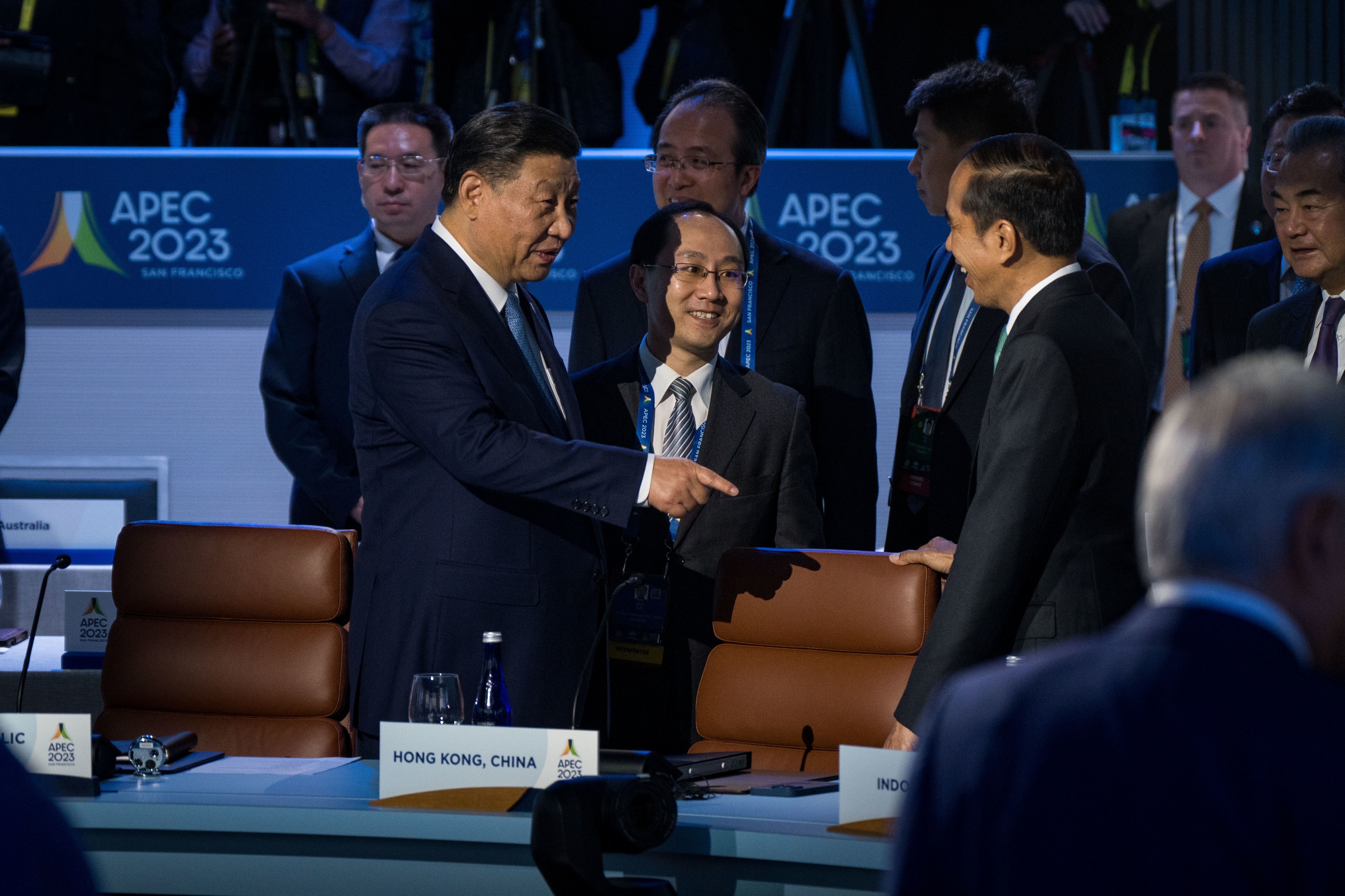 Chinese President Xi Jinping chats with Indonesia's President Joko Widodo as they arrive for the APEC Leaders Retreat on the last day of the Asia-Pacific Economic Cooperation (APEC) Leaders' Week at Moscone Center in San Francisco, on November 17, 2023.